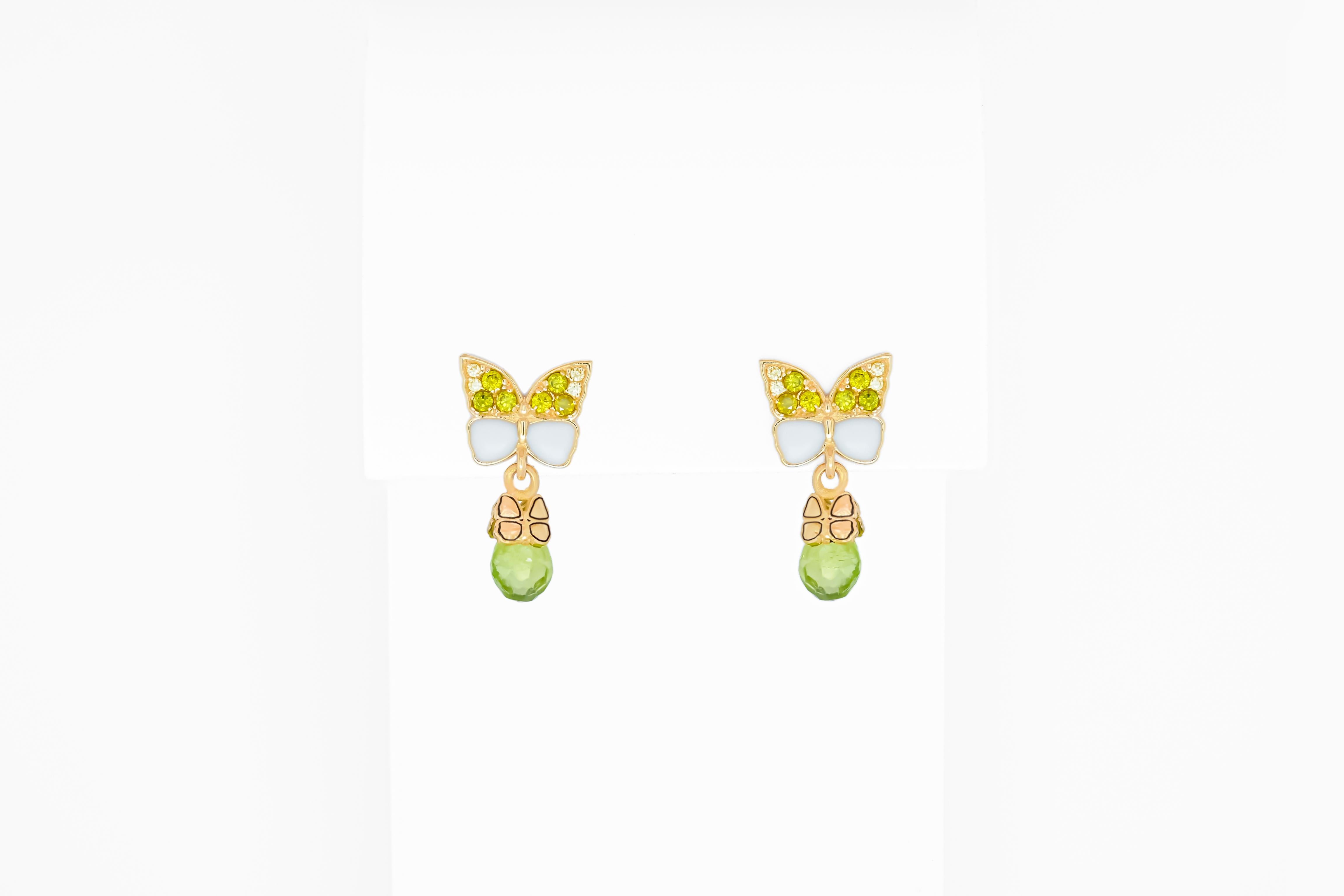 Butterfly 14k  gold earrings with peridot briolettes. 
Peridot Dangle Earrings for Women. Peridot Drop Earrings. Beautiful earrings for everyday wearing. 

Metal: 14 karat gold
Weight: 3 g.
Size: 19x10
Peridots 2 pieces - apple green color,