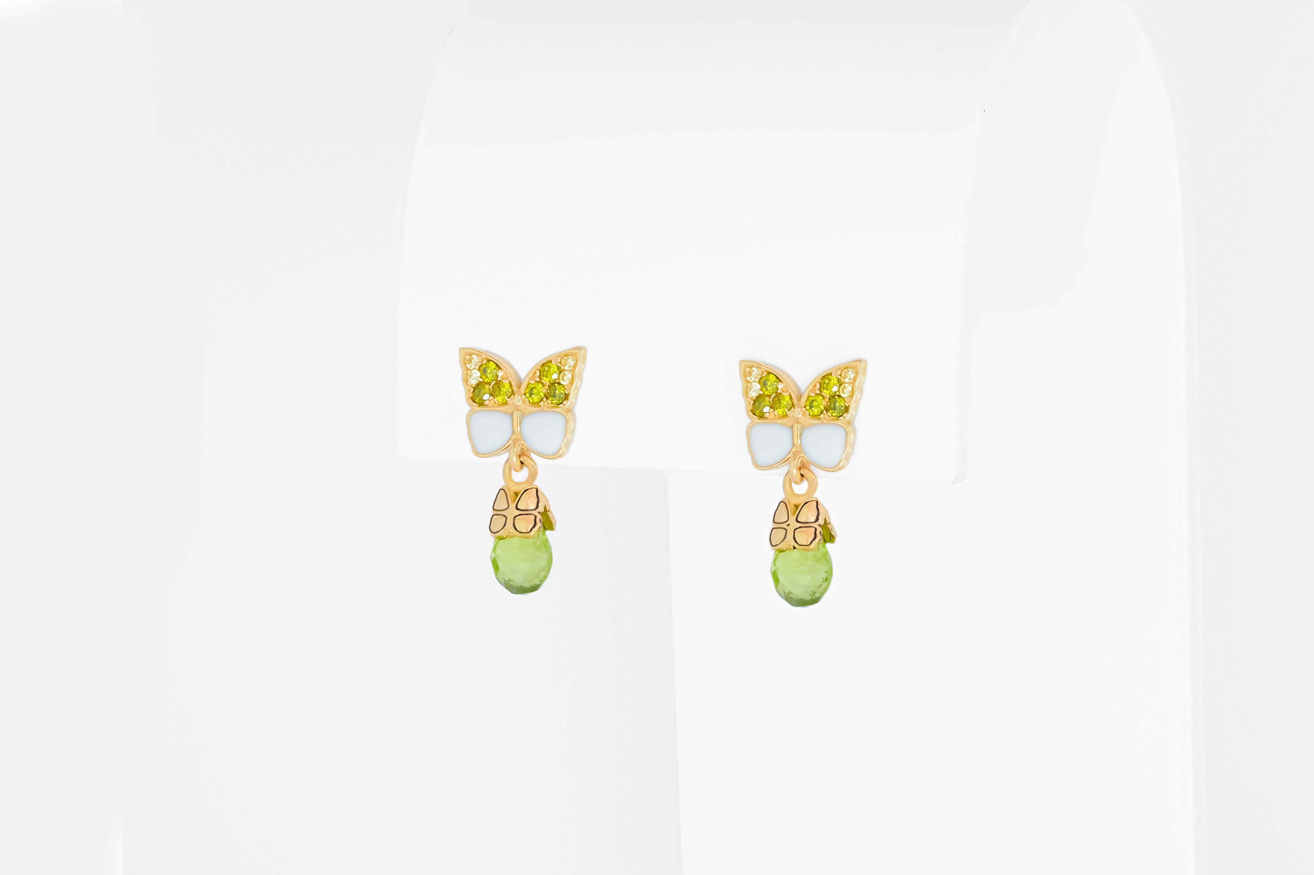 Modern Butterfly 14k gold earrings with peridot briolettes.  For Sale