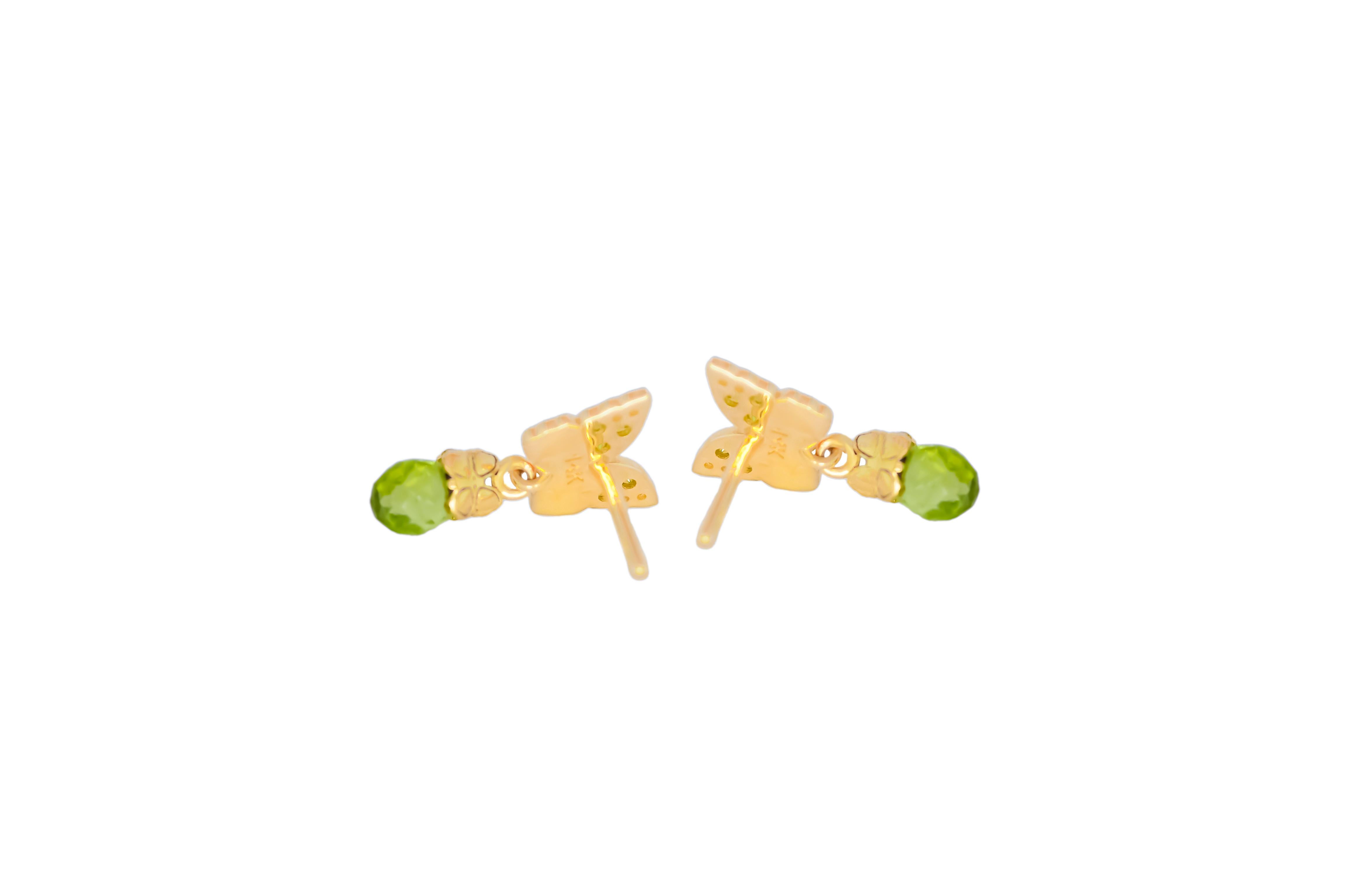 Briolette Cut Butterfly 14k gold earrings with peridot briolettes.  For Sale