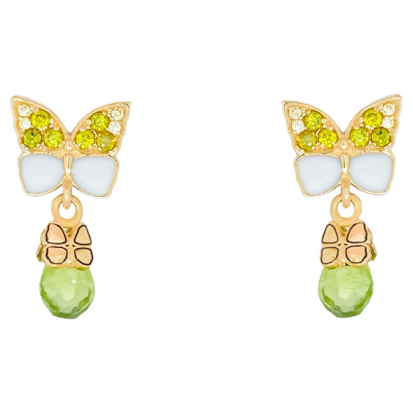 Butterfly 14k gold earrings with peridot briolettes.  For Sale