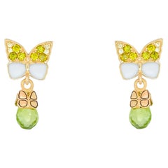 Butterfly 14k gold earrings with peridot briolettes. 