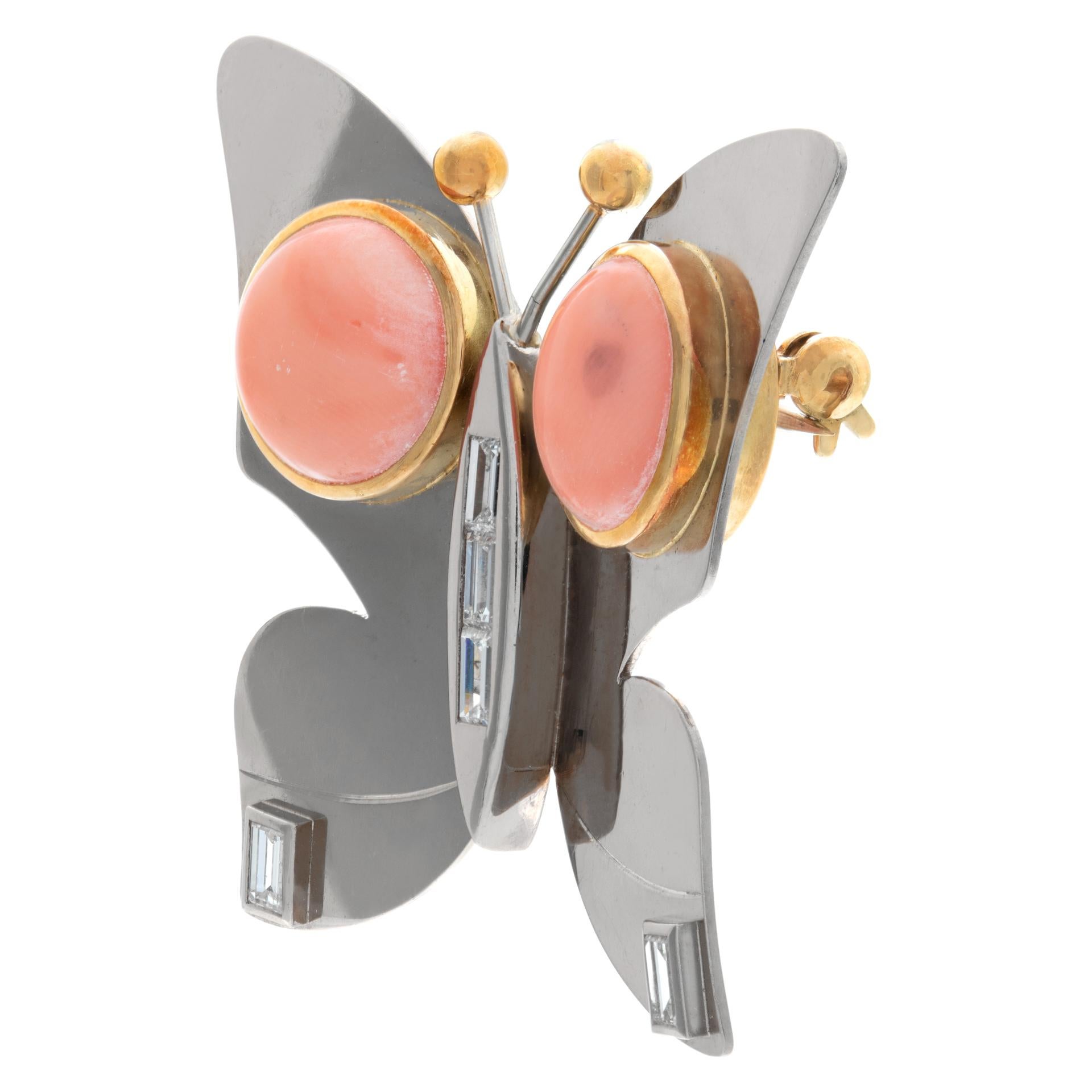 Butterfly brooch with cabochon angel skin coral and baguette diamonds set in 18k white and yellow gold  (approx. 0.75 cts). Measurements 40mm width x 40mm height.