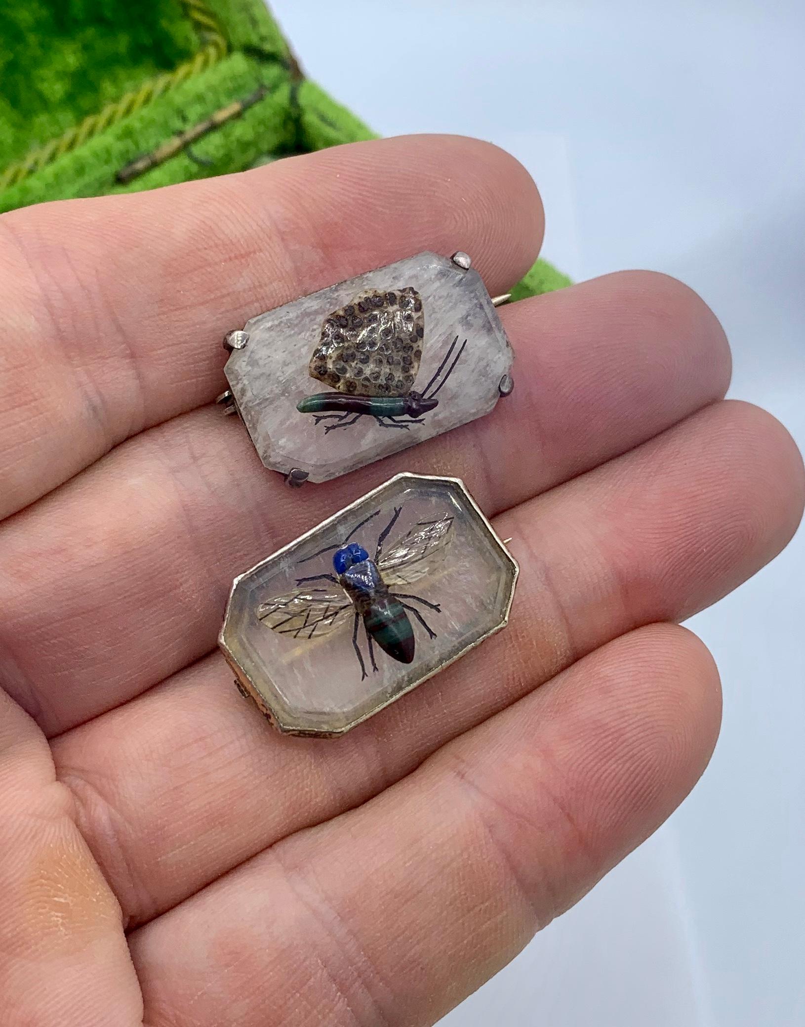 A wonderful and rare pair of antique Butterfly and Bee Insect Brooch Pins.  These extraordinary jewels are in the style of cameos or intaglios.  The insects are created with hardstones including Agate and Lapis Lazuli and set in carved Rock Crystal.