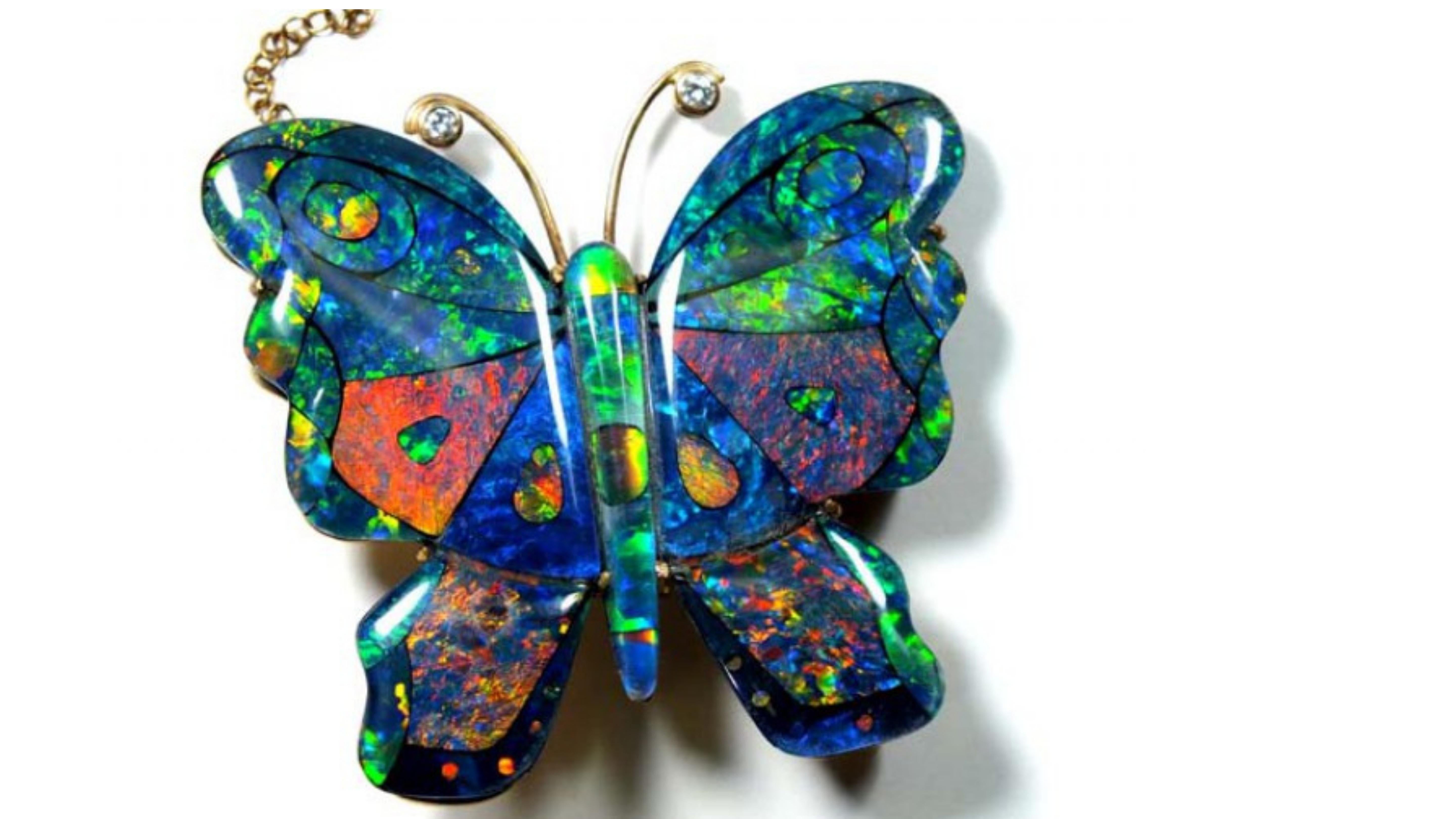 

  . This is from the Lighting Ridge in Australia and shows off very birght colors Blue Green Orange  Yellow Red.   And this Mosaic design is which is different pieces put together to create this unique item.  


If you are looking for anything