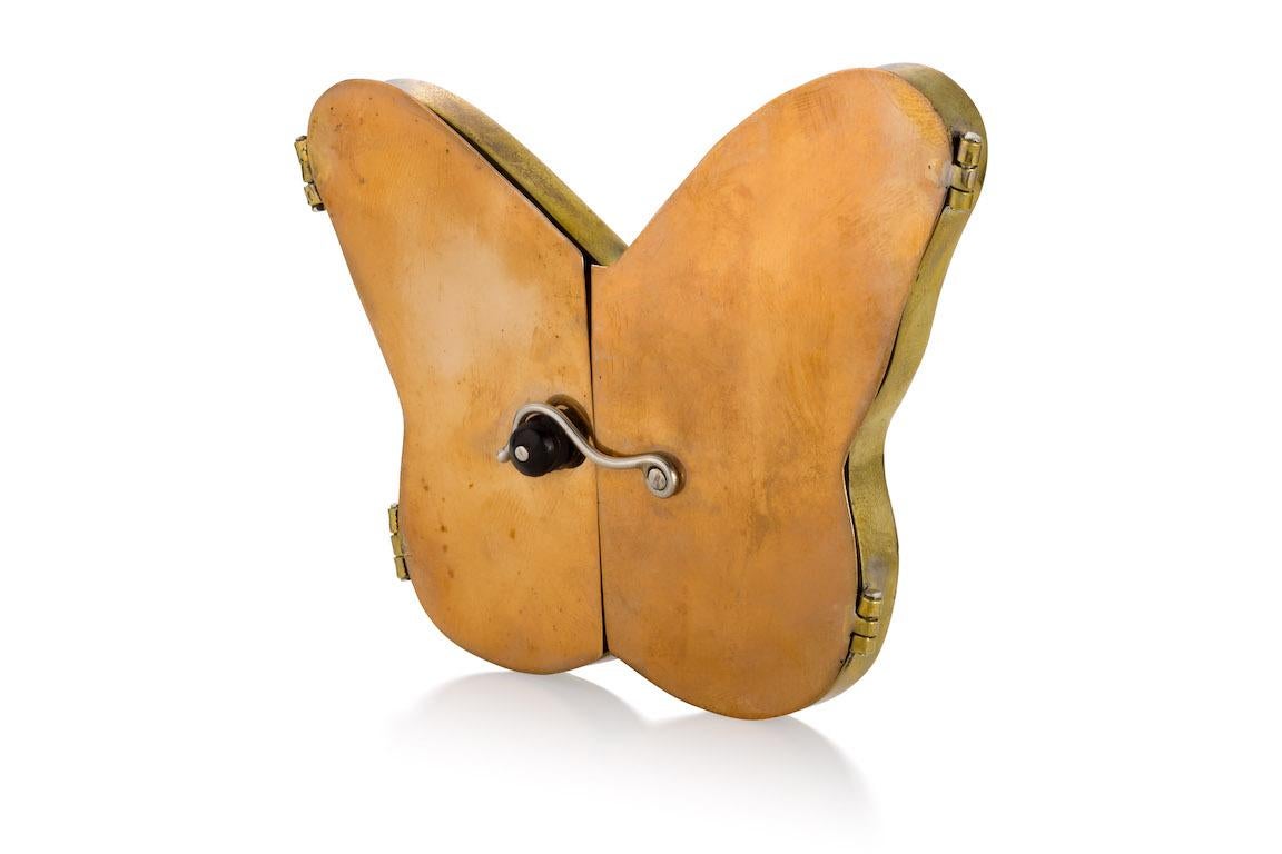 This Objects d'Art Box is made of Brass, Bronze, Silver, Wood (repurposed Ebony), Butterfly Wings and Mica. 
Butterfly Box is a tribute to Helen Keller, who had a profound awareness about the world around her. 
One might surmise that her world was