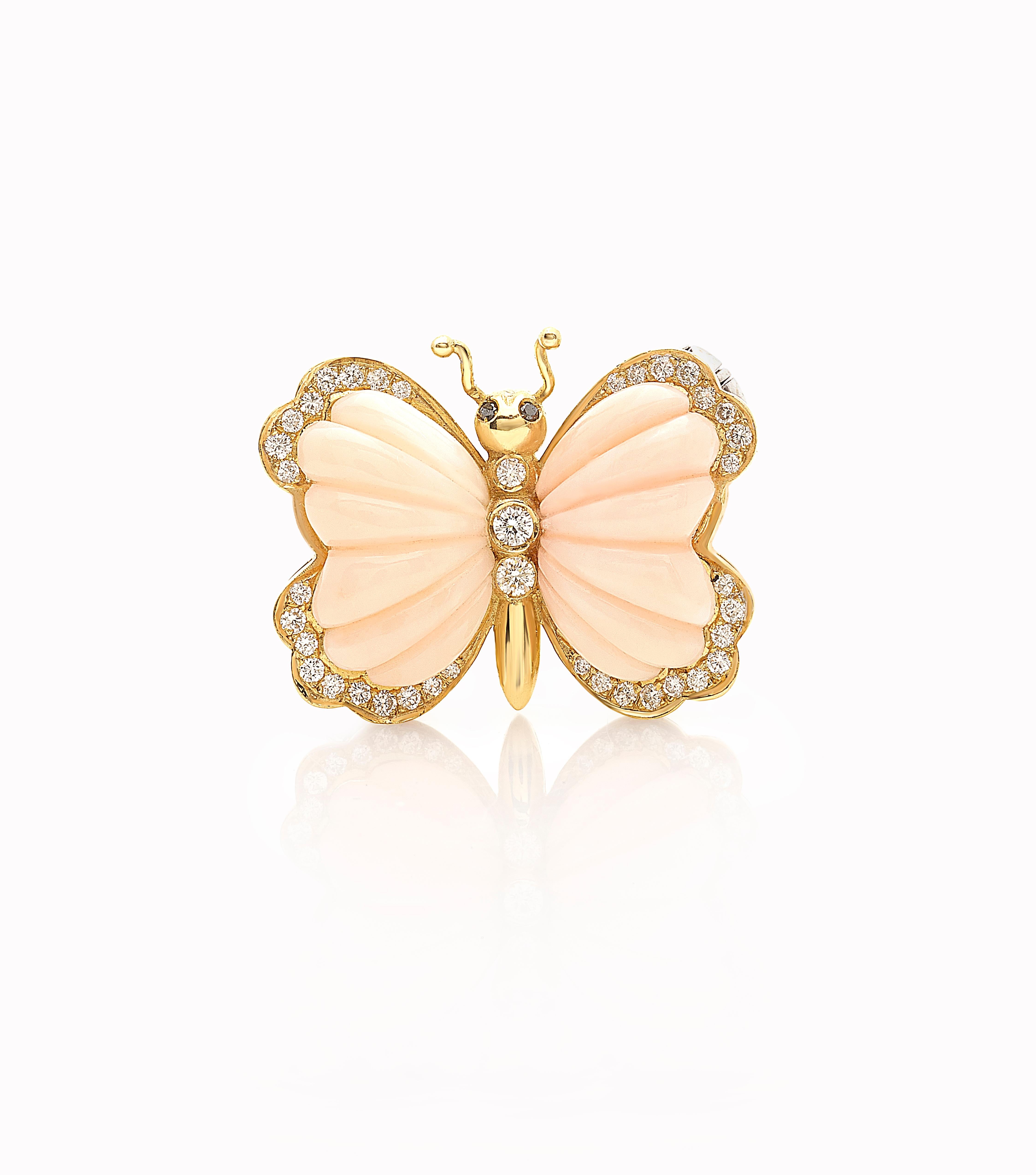 A unique-piece Butterfly brooch handcrafted in Italy by Neapolitan artisan .
The power of the item is also related to a unique Pink coral stonecut and black diamonds in the eyes. 
The brooch is made in yellow 18kt gold.

