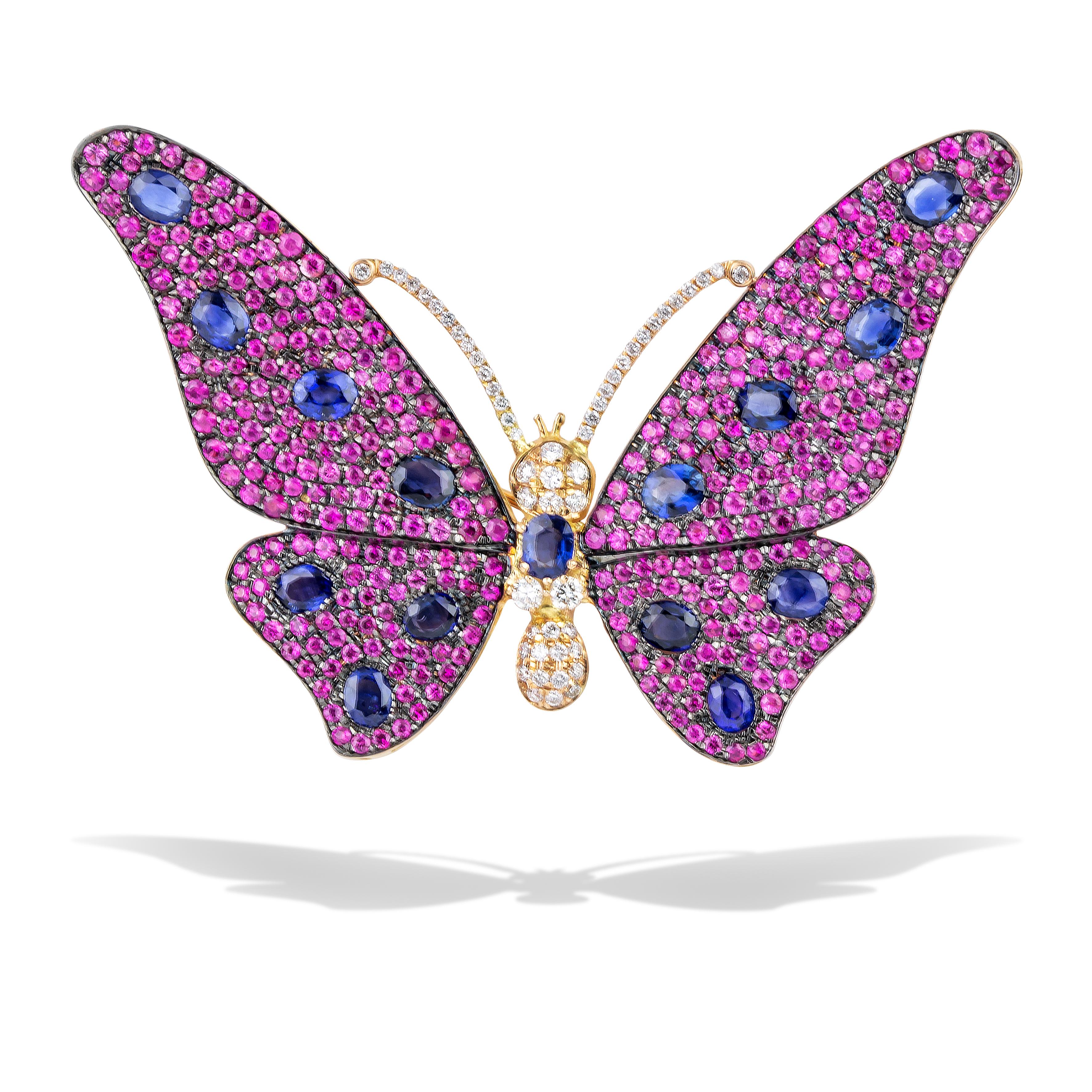 Unique Butterfly Brooch with pave pink-red sapphires, brilliant cut diamonds and oval blue sapphires, handcrafted in 18Kt rose gold. The elegance of the Greek nature inspired Nicofilimon to create this masterpiece. Set in rose gold, interlacing pink