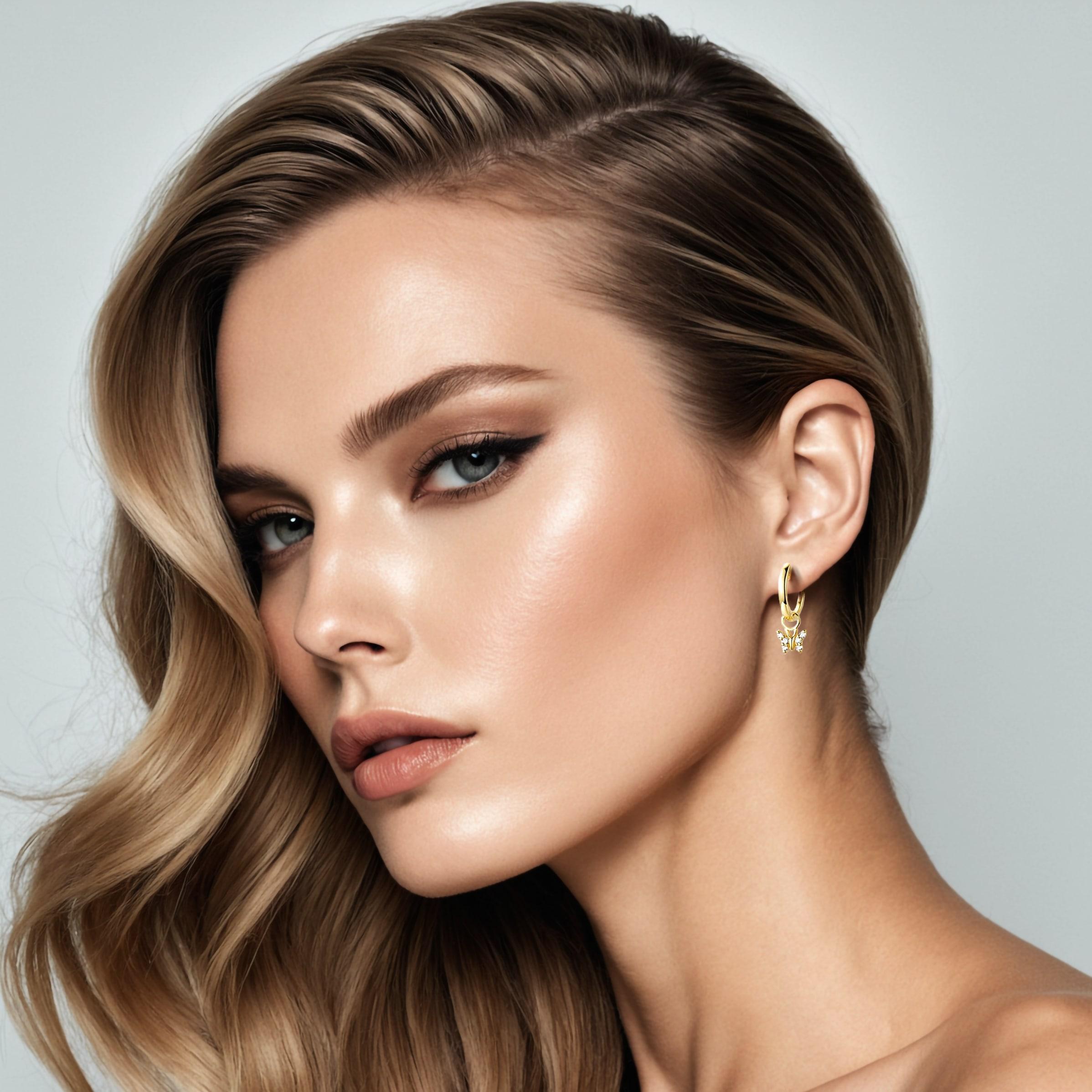 Délicates et fantaisistes, ces boucles d'oreilles Butterfly Charm en or 14 carats avec diamants sont ornées de charmants papillons qui pendent gracieusement aux boucles d'oreilles classiques en or. Réalisés en or massif, les papillons ajoutent une