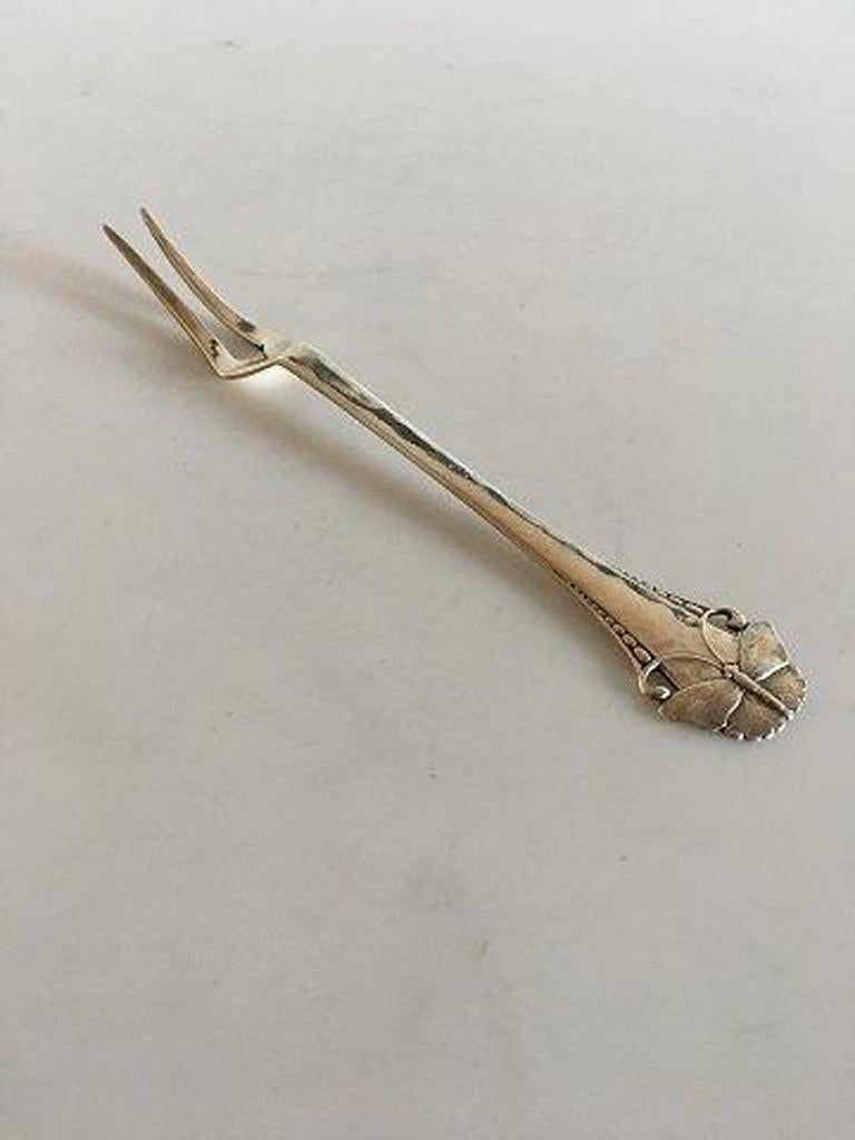 Butterfly cold cuts fork in silver. 

Measures: 15 cm L. (5 29/32