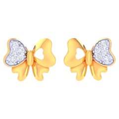 Boucles d'oreilles enfant en or 18 carats avec diamant papillon