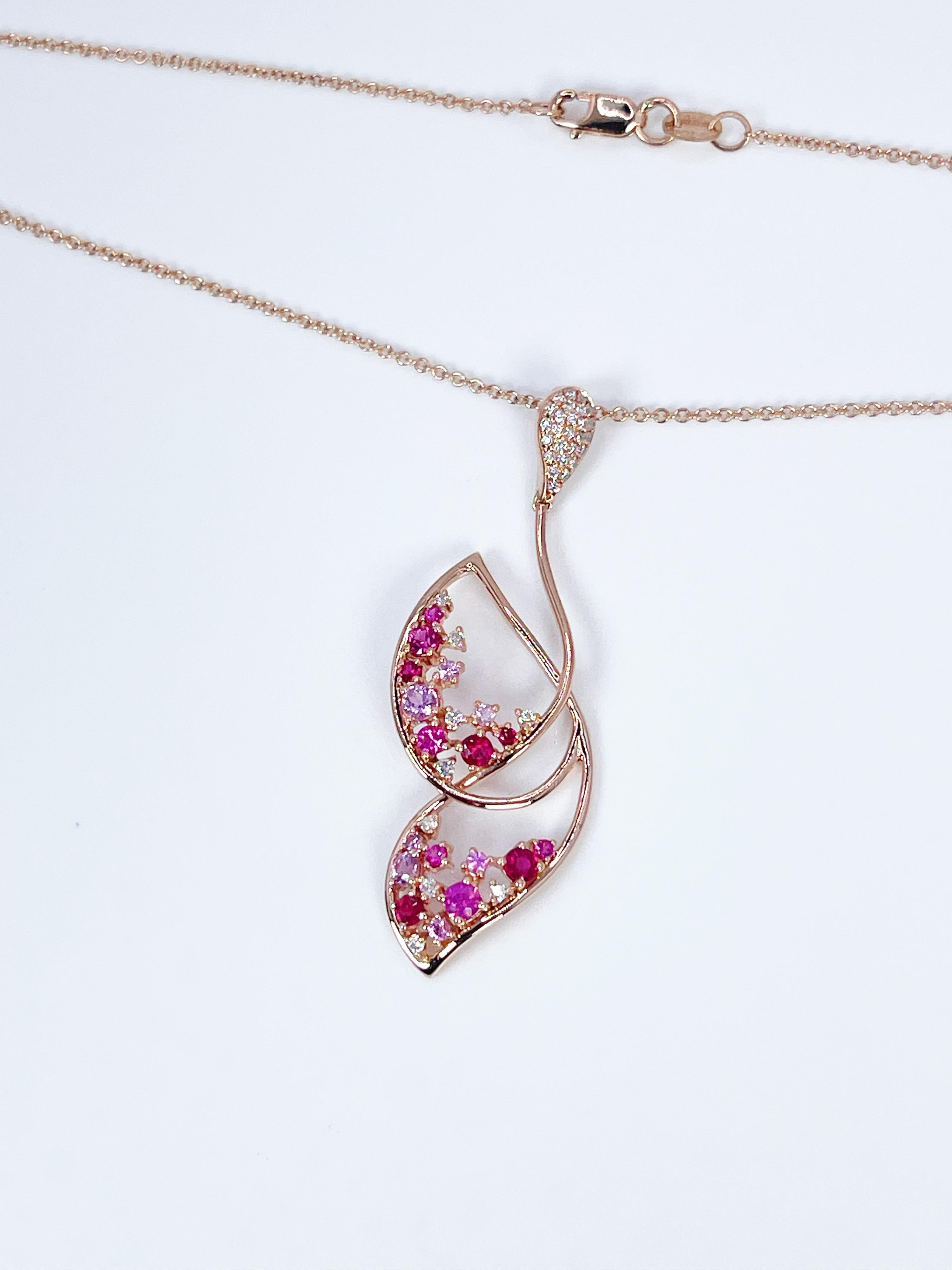 Stunning aartistic pendant made with abstract butterfly in 14KT rose gold. The gemstones are rubies,sapphires and diamonds that were carefully matched to make the ombre pinkish red.

GRAM WEIGHT: 3.72gr
GOLD: 14KT rose gold

NATURAL SAPPHIRE(S)
Cut: