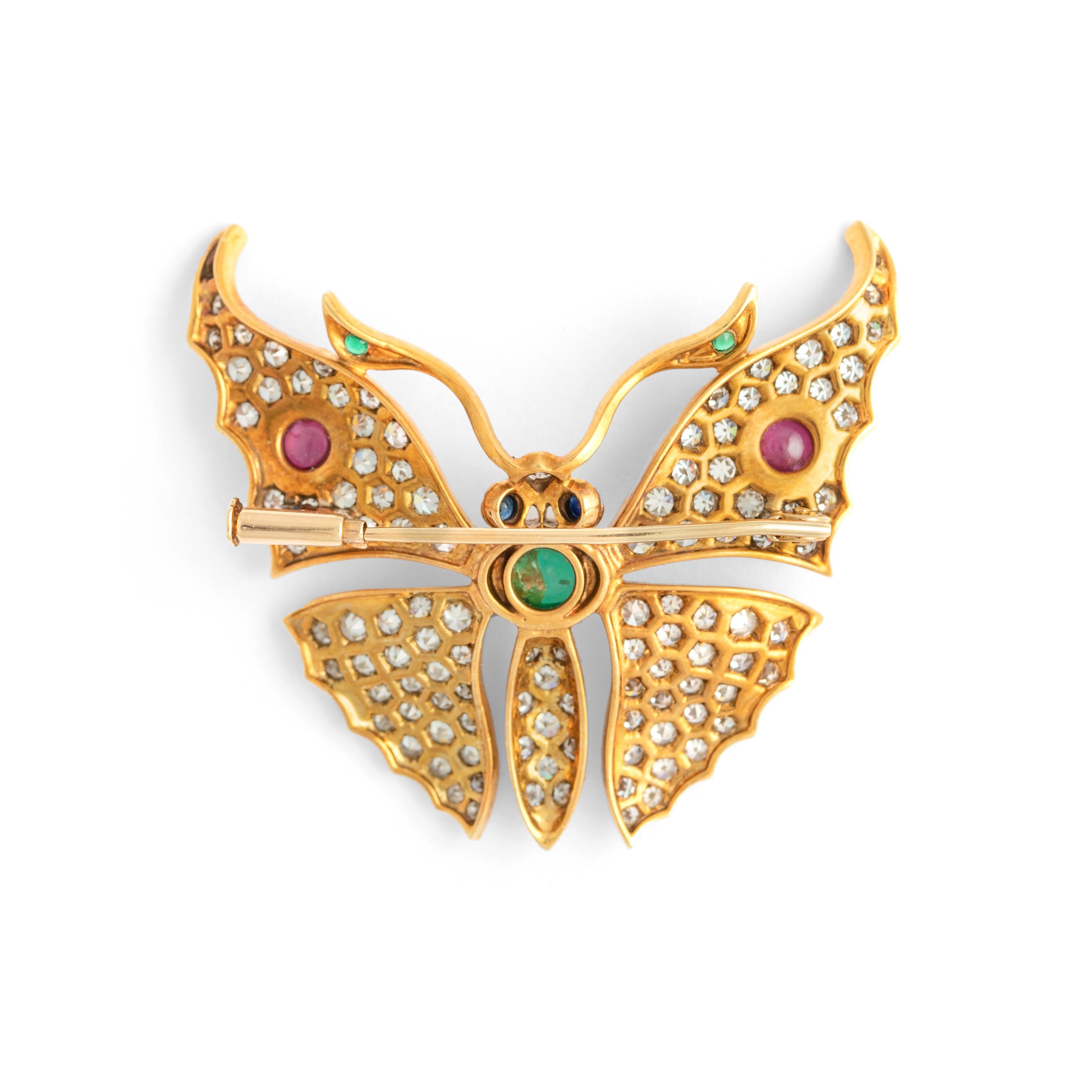 Butterfly diamond, sapphire, emerald and ruby yellow gold 18K brooch.
Height: approximate 4.00 centimeters
Width: 4.50 centimeters.

Total weight: 12.15g