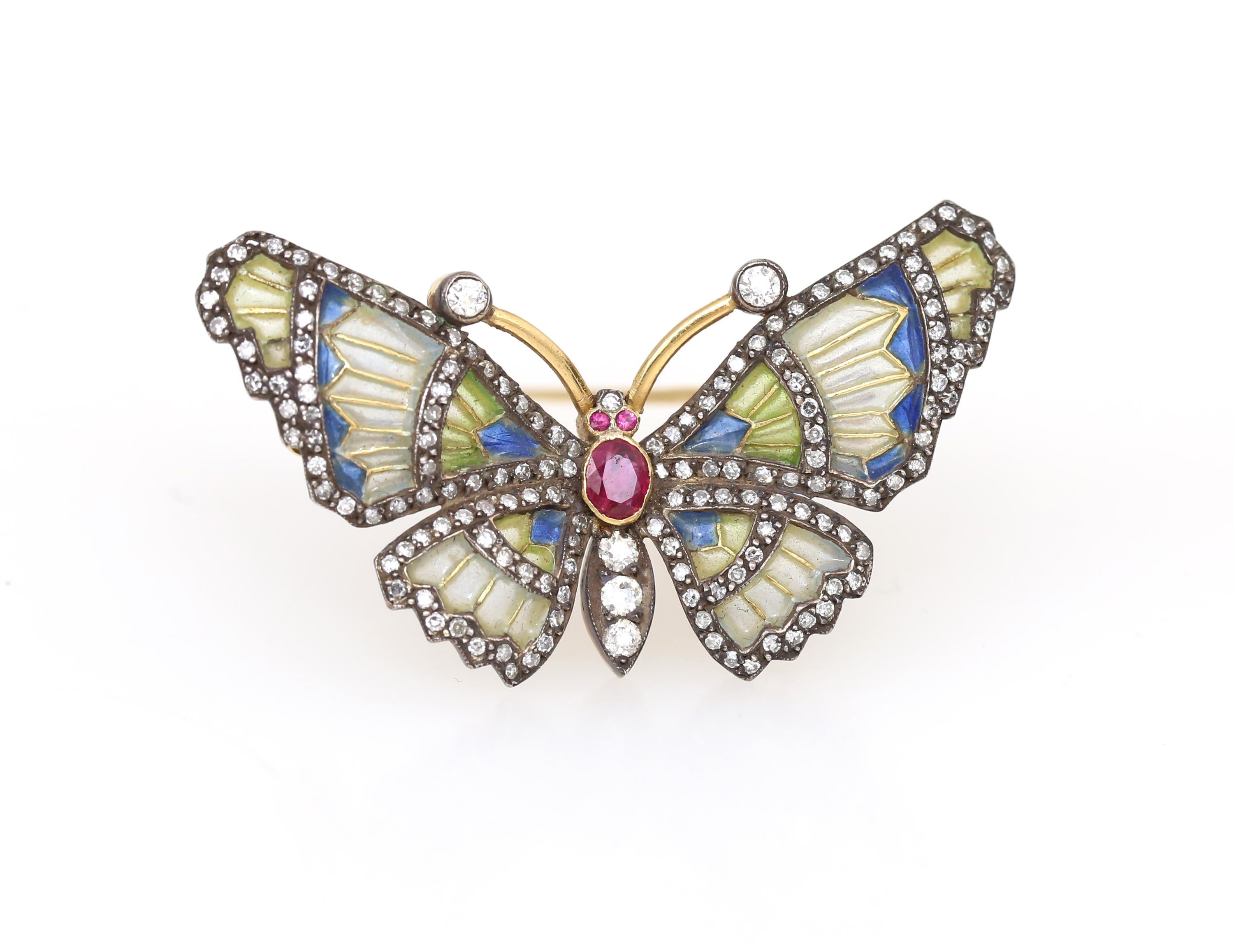 Diamonds Ruby Color Enamel Butterfly 18 Karat Gold Floral Pin Brooch. 
The butterfly body set with a Ruby and 3 Diamonds, the wings enamelled almost transparent - an absolute marvel of jeweller craft! Plique-à-jour, with circular and rose-cut