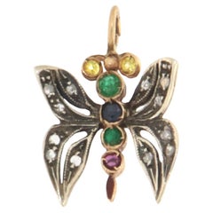 Collier pendentif papillon, saphirs, émeraudes, rubis et or jaune 14 carats