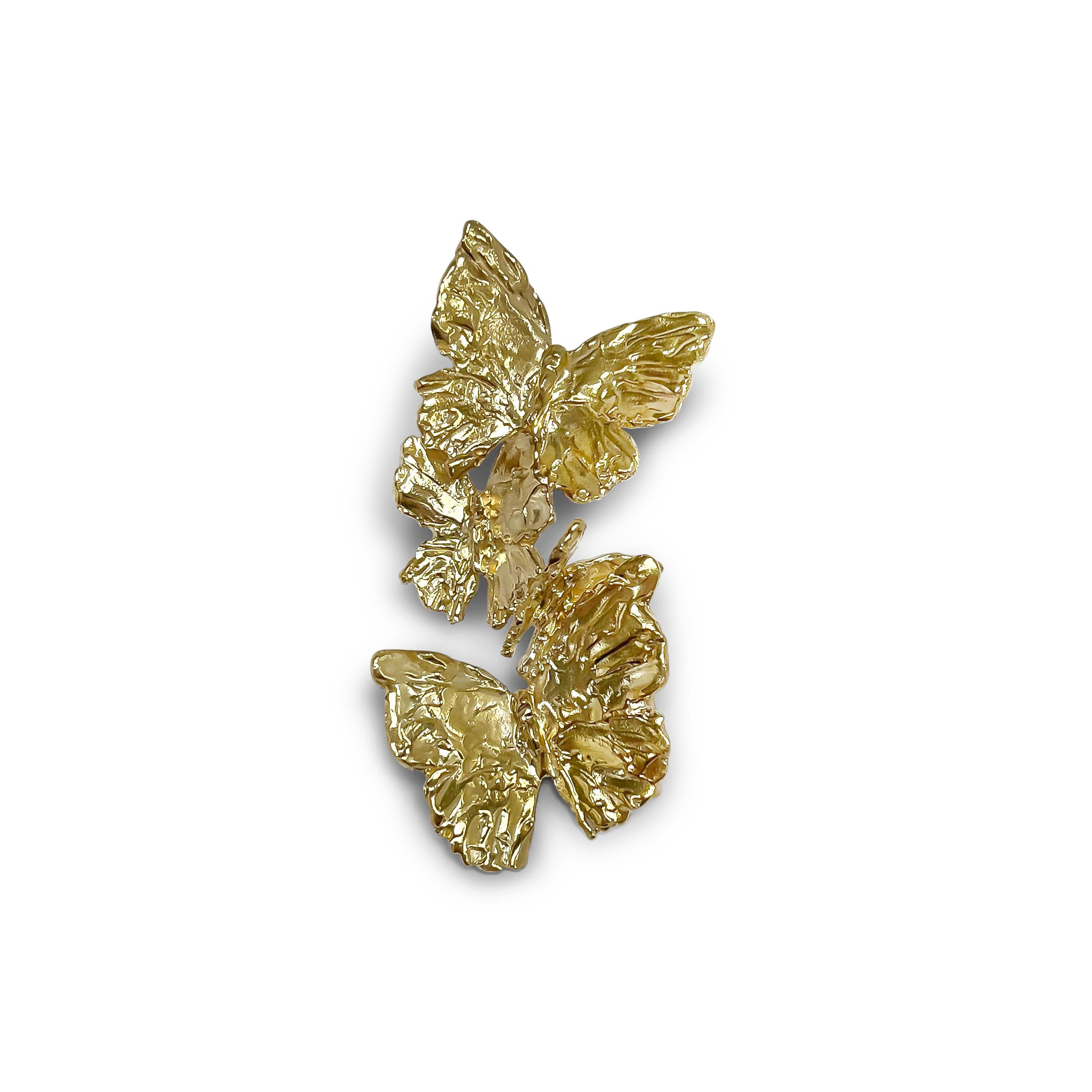 Intention: Metamorphosis 

Design: A wearable reminder of one of the delicate butterfly's superpower. Wear it, and step into your own. Four hand carved butterflies balance just so to alight on the ear, drawing attention to your face and eyes.