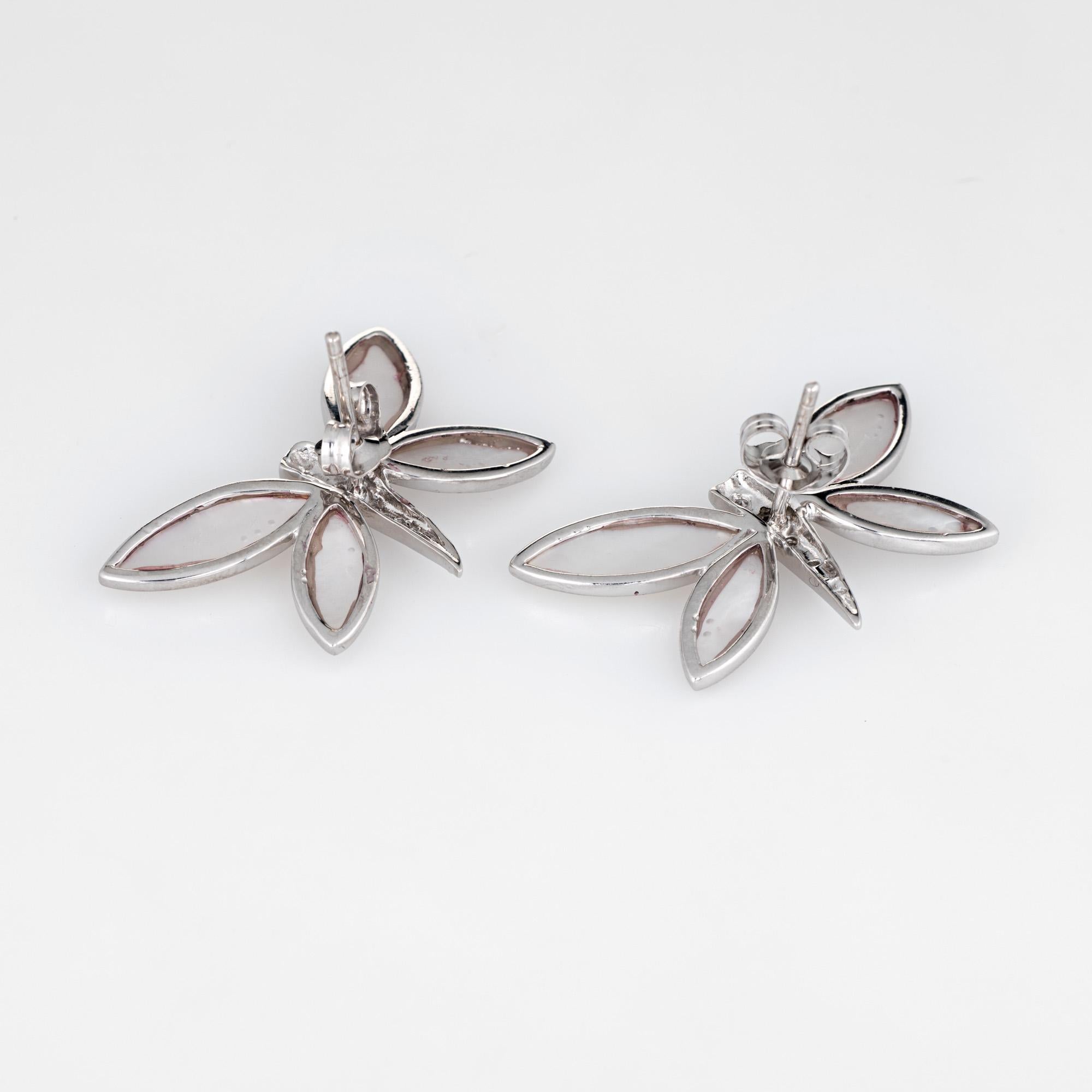 Elegant pair of diamond & mother of pearl butterfly earrings crafted in 14k white gold. 

Mother of pearl is bezel set into the mounts measuring 12mm x 4mm (upper) and 10mm x 4mm (lower). The diamonds total an estimated 0.08 carats (estimated at I-J