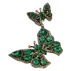 Boucles d'oreilles papillon émeraude avec diamants et or blanc et jaune