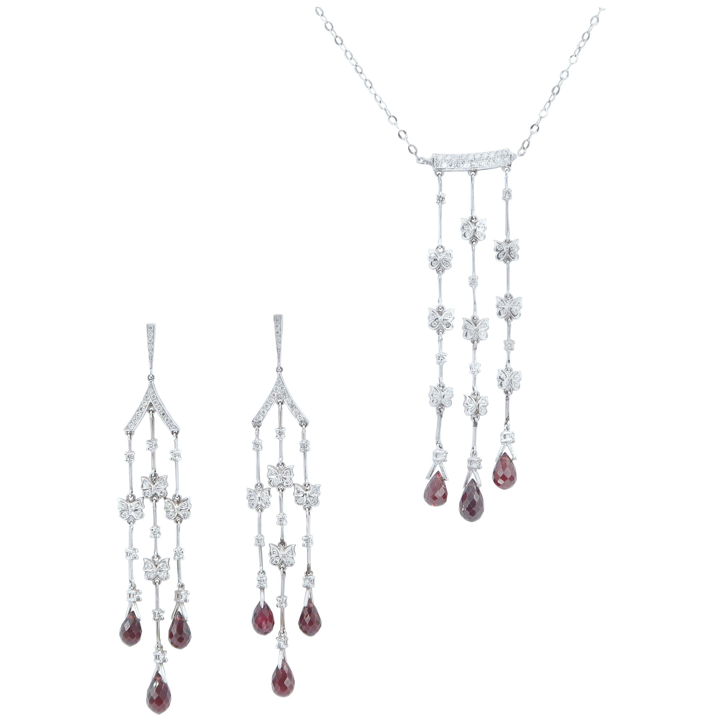 Butterfly Diamond Dangle Earrings with Garnet Drops in 18K White Gold
(Necklace not included)

Gold : 18K White Gold 17.52g.
Diamond : 1.49ct.
Garnet : 11.96cts.
Length : 3.5