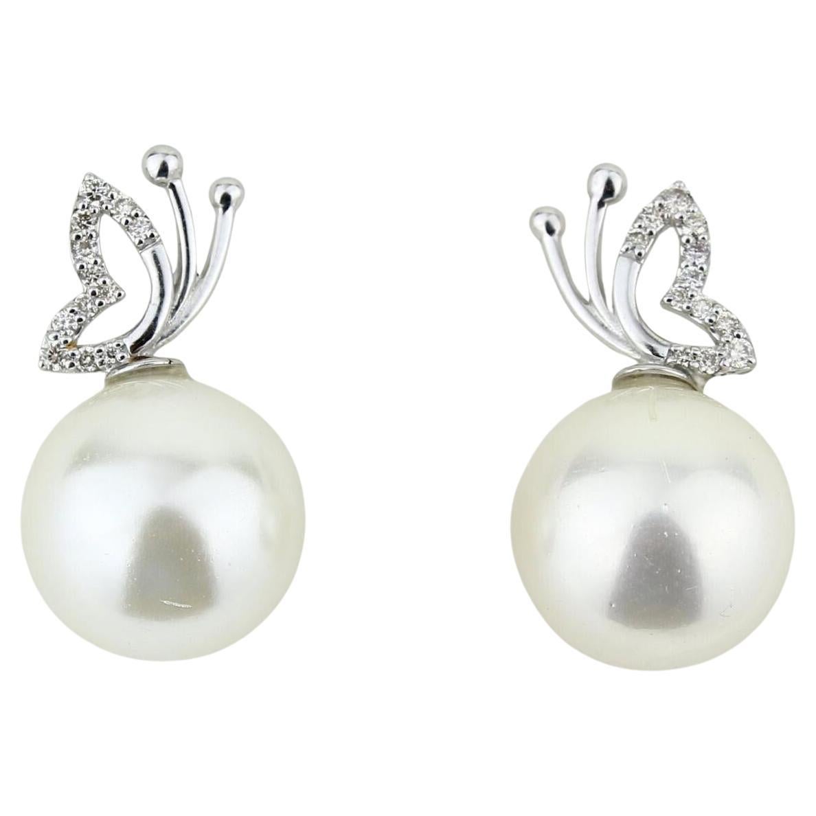 Boucles d
oreilles en or massif 14K avec perle papillon et diamant naturel (certifié) en vente