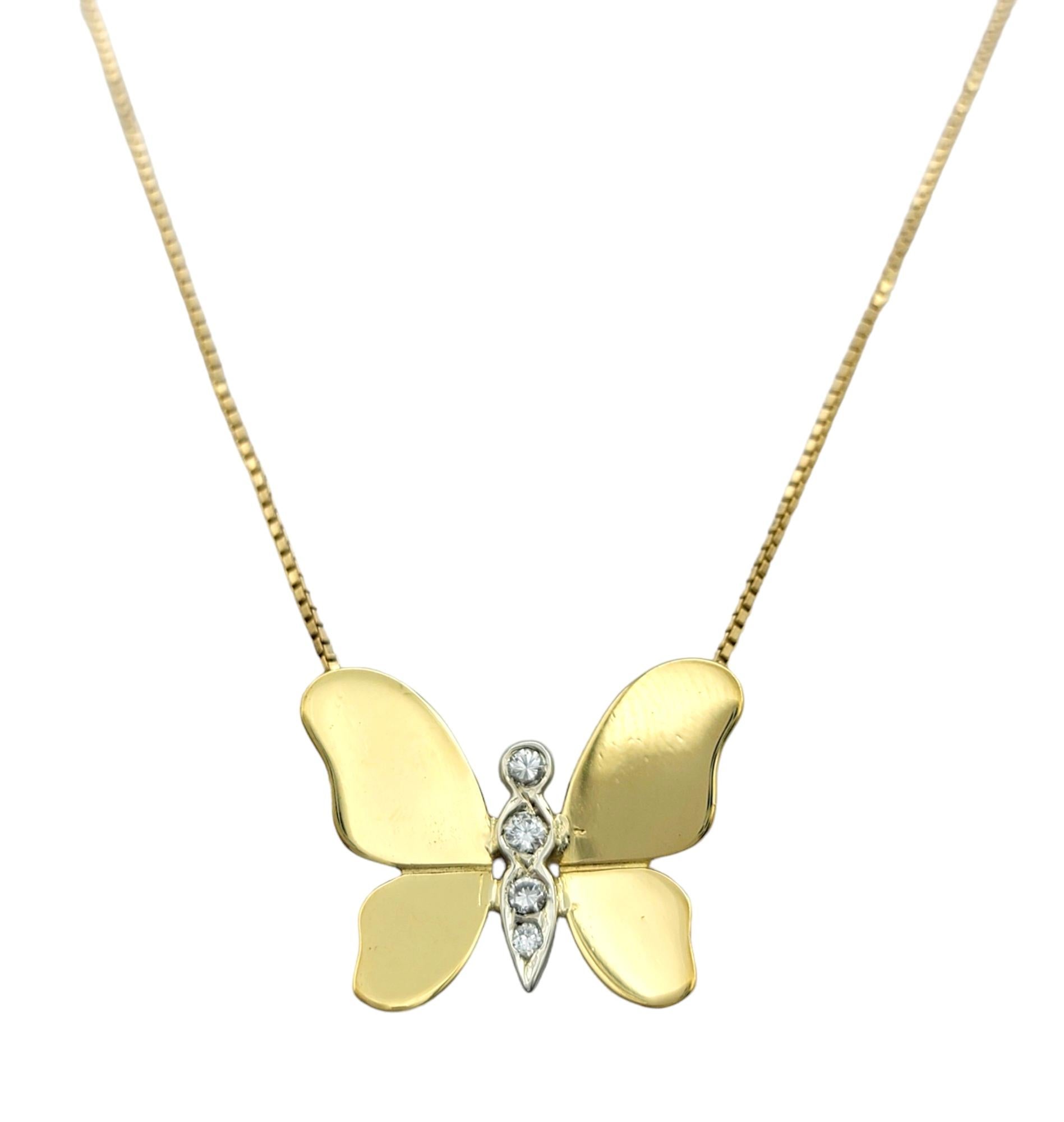 This stunning butterfly necklace, set in 18 karat yellow gold, is a graceful work of art. Delicately crafted, it captures the essence of a fluttering butterfly with its simple stationary design. 

The shimmering diamonds adorning the body of the