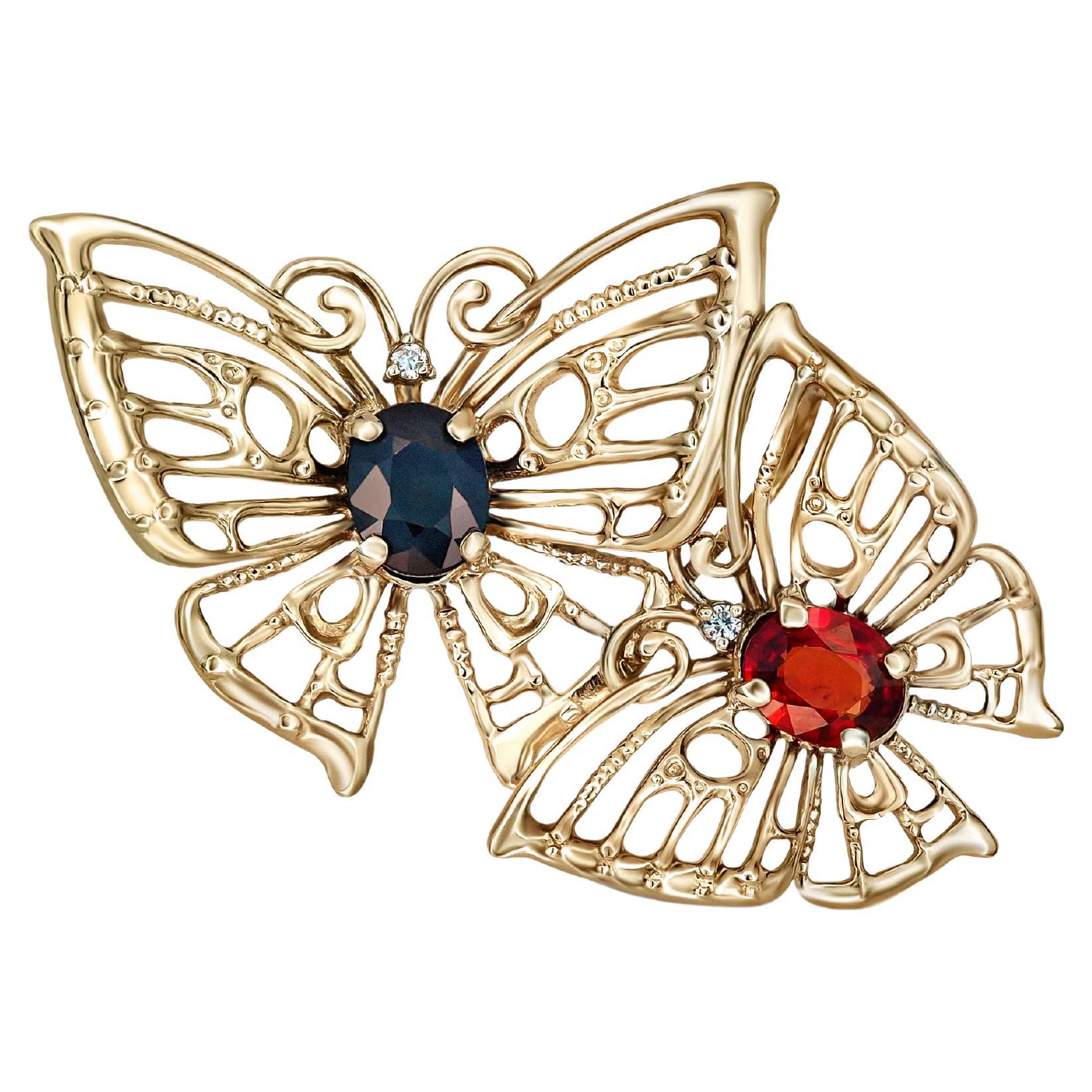 Butterfly pendant with sapphires in 14k gold. 