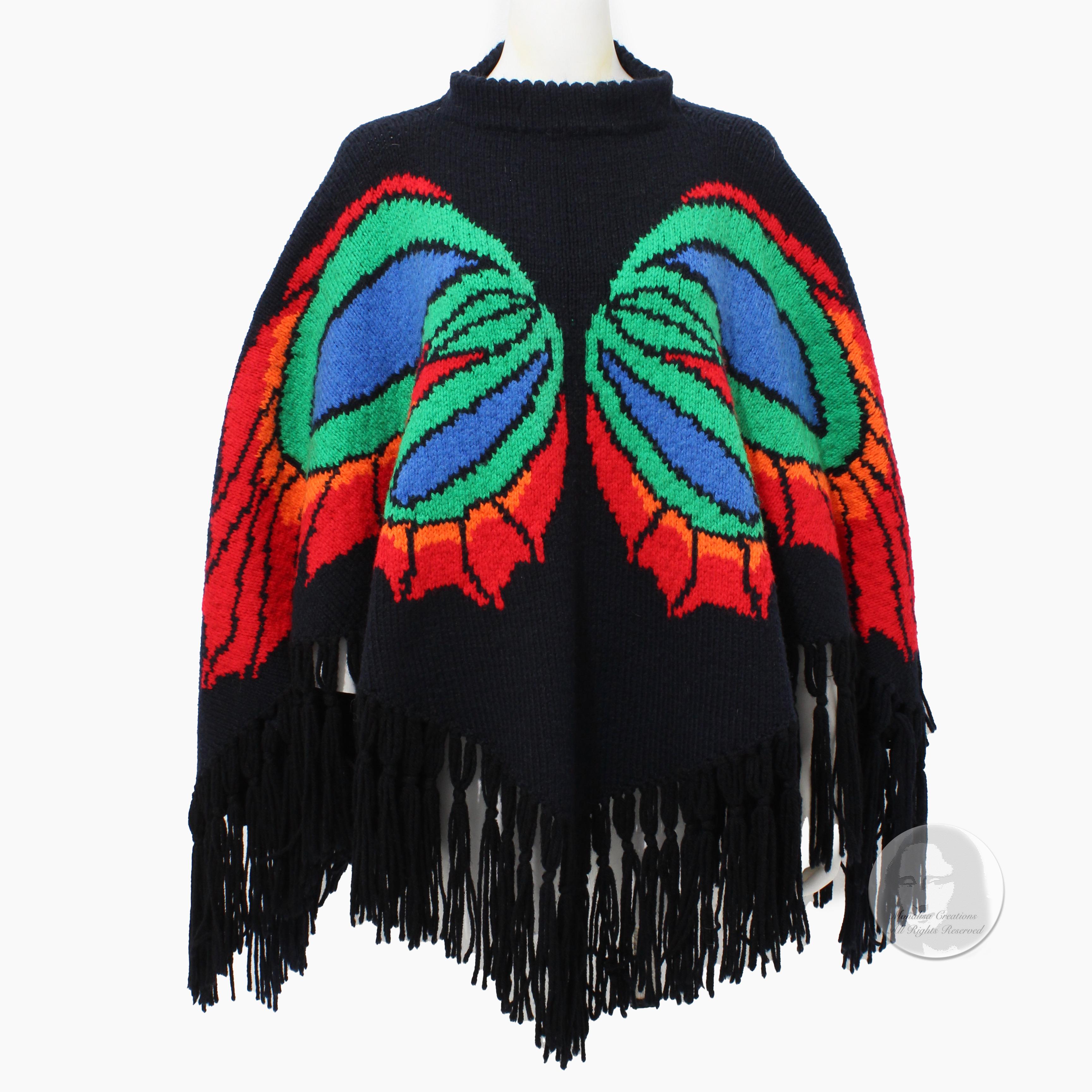 Preowned, vintage knit poncho with butterfly motif and fringe, likely made in the 80s. We love the contrast of the butterfly against the black background - it's so pretty. 

A great hippie boho piece! No manufacturer, content or size label - it