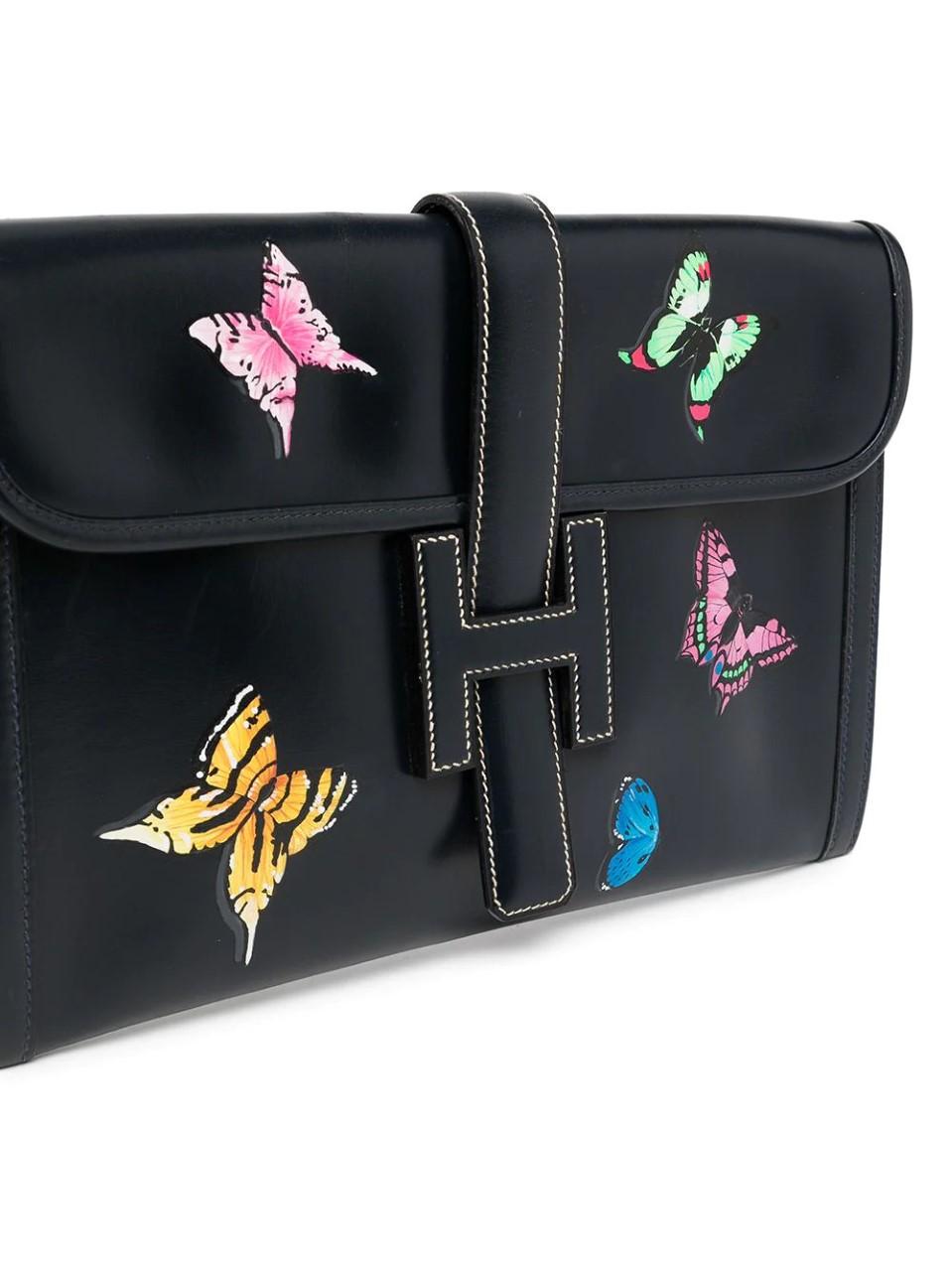 Add a glamorous feel to a more casual outfit with this one-of-a-kind piece. Featuring a unique hand-painted butterfly motif in a vivid colour palette, the bag can be secured using the iconic 'H' logo fold-over strap. Designed with contrasting