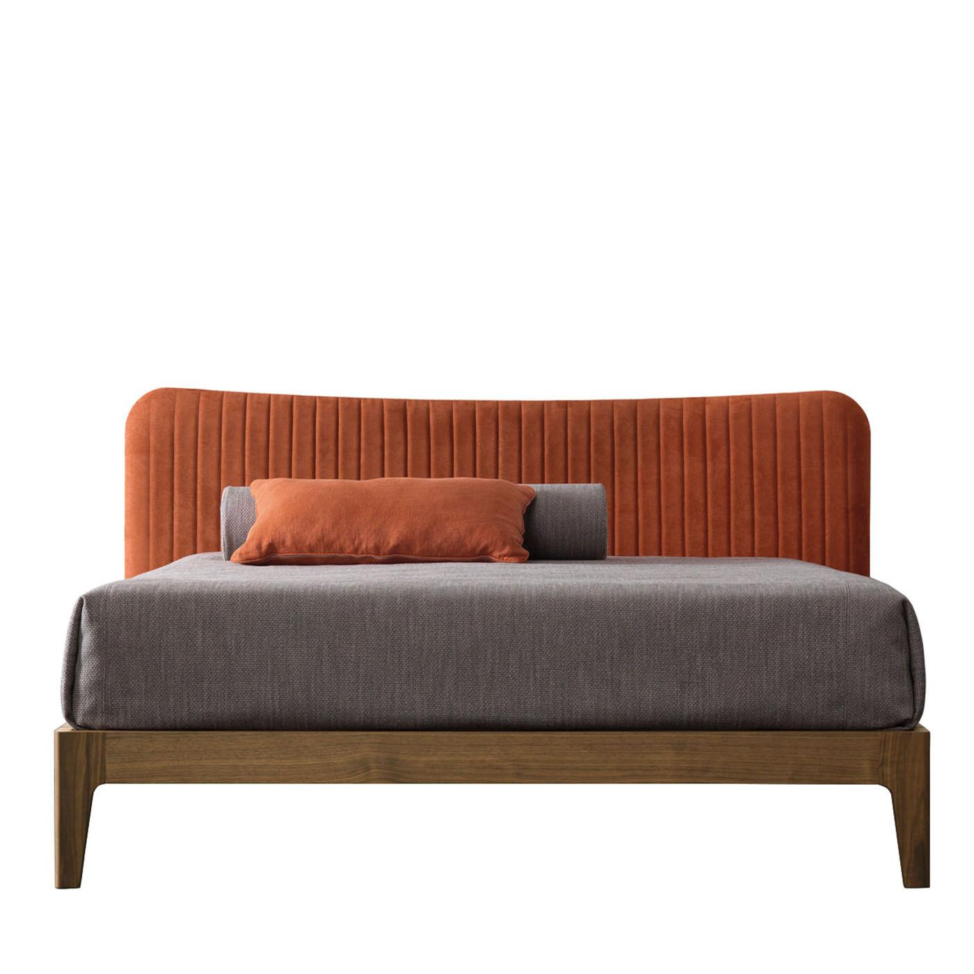 Bed frame in Canaletto walnut wood finished in Havana, designed to fit a 190x205 cm slatted base included. The headboard features a structured, vertically stitched microfiber upholstery with a water-repellent and easy-to-clean paprika color,