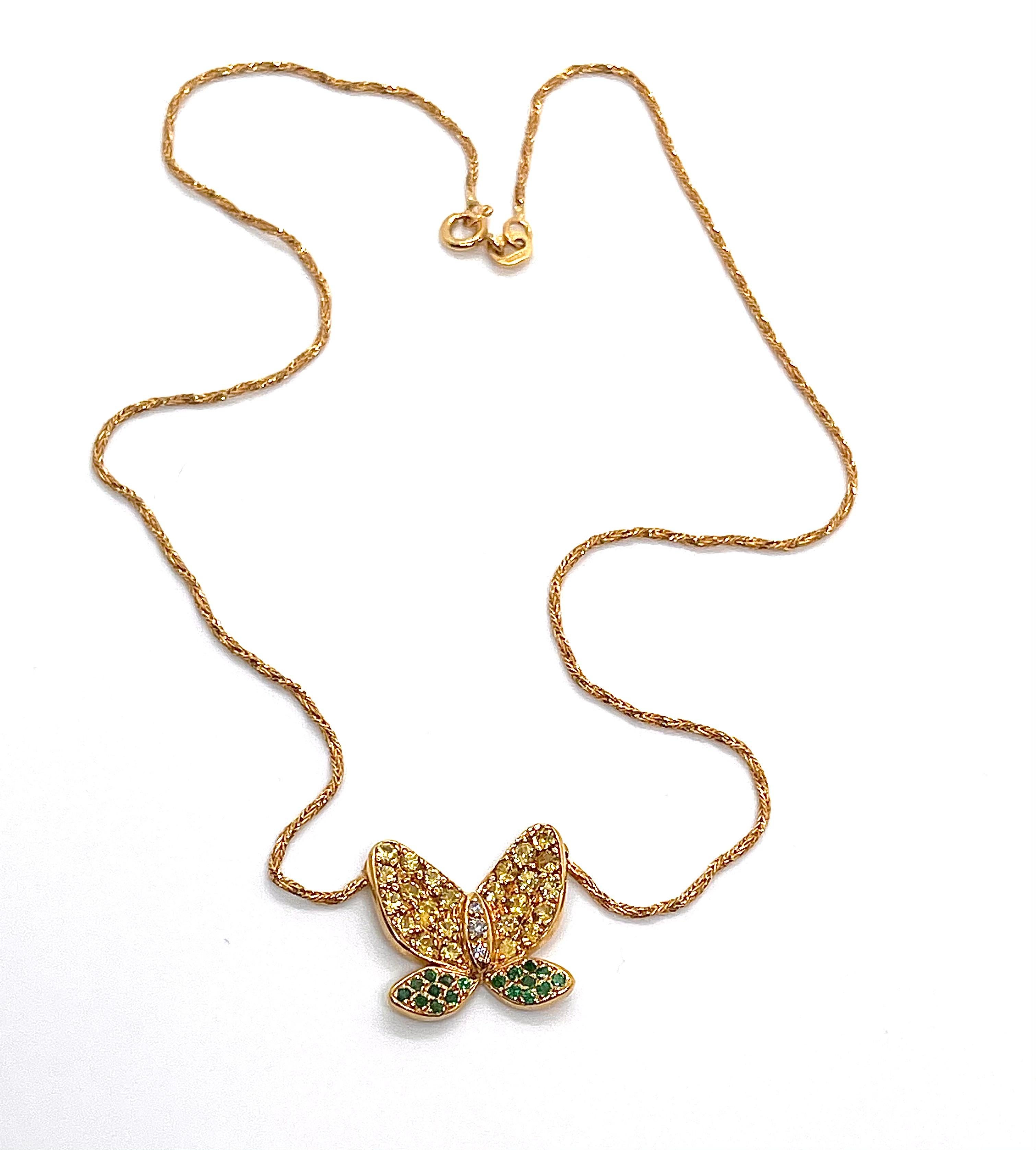 A gorgeous butterfly-shaped colourful necklace, paved with beautiful and rare yellow sapphires, emeralds and diamonds. The necklace is made of 18K yellow gold as the eye-catching butterfly-shaped pendant. The butterfly's upper wings are paved with