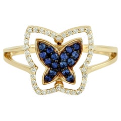 Bague en or jaune 18k en forme de papillon pavée de saphirs bleus et de diamants