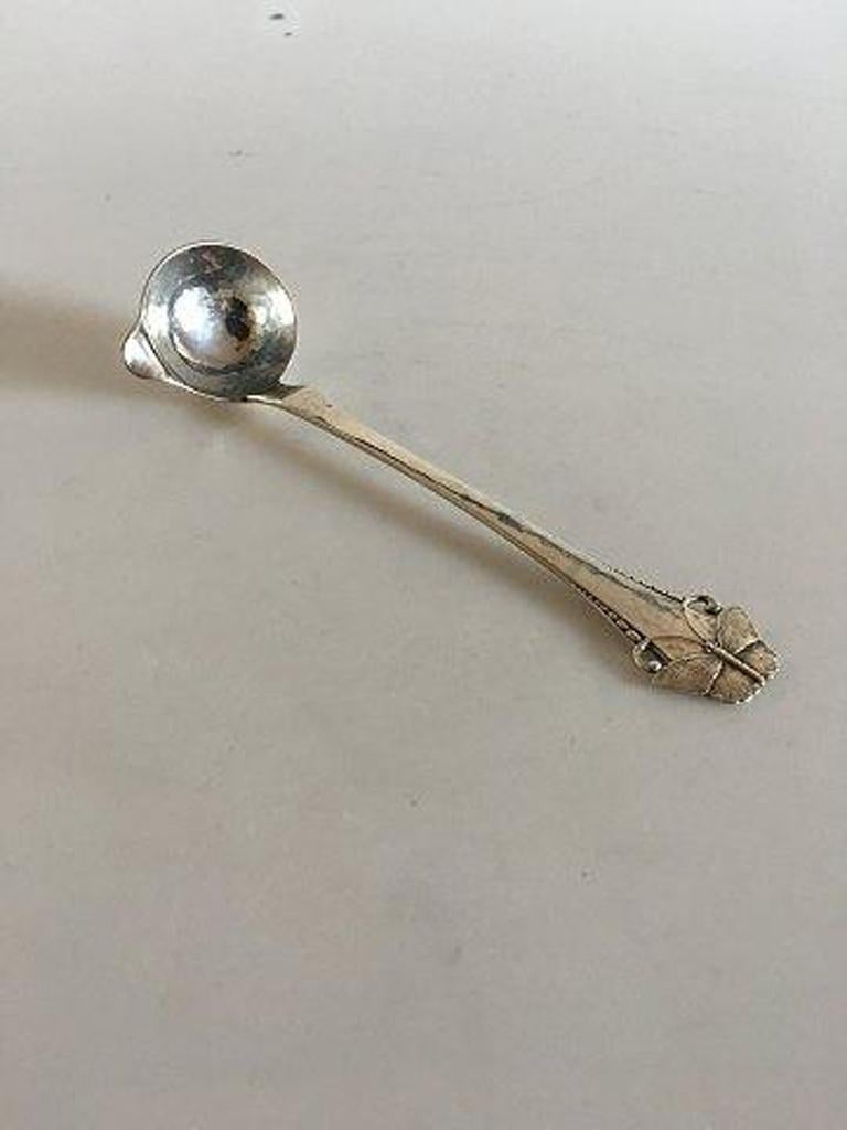 Butterfly silver dressing spoon / creme ladle. 

Measures: 14.5 cm L. (5 45/64