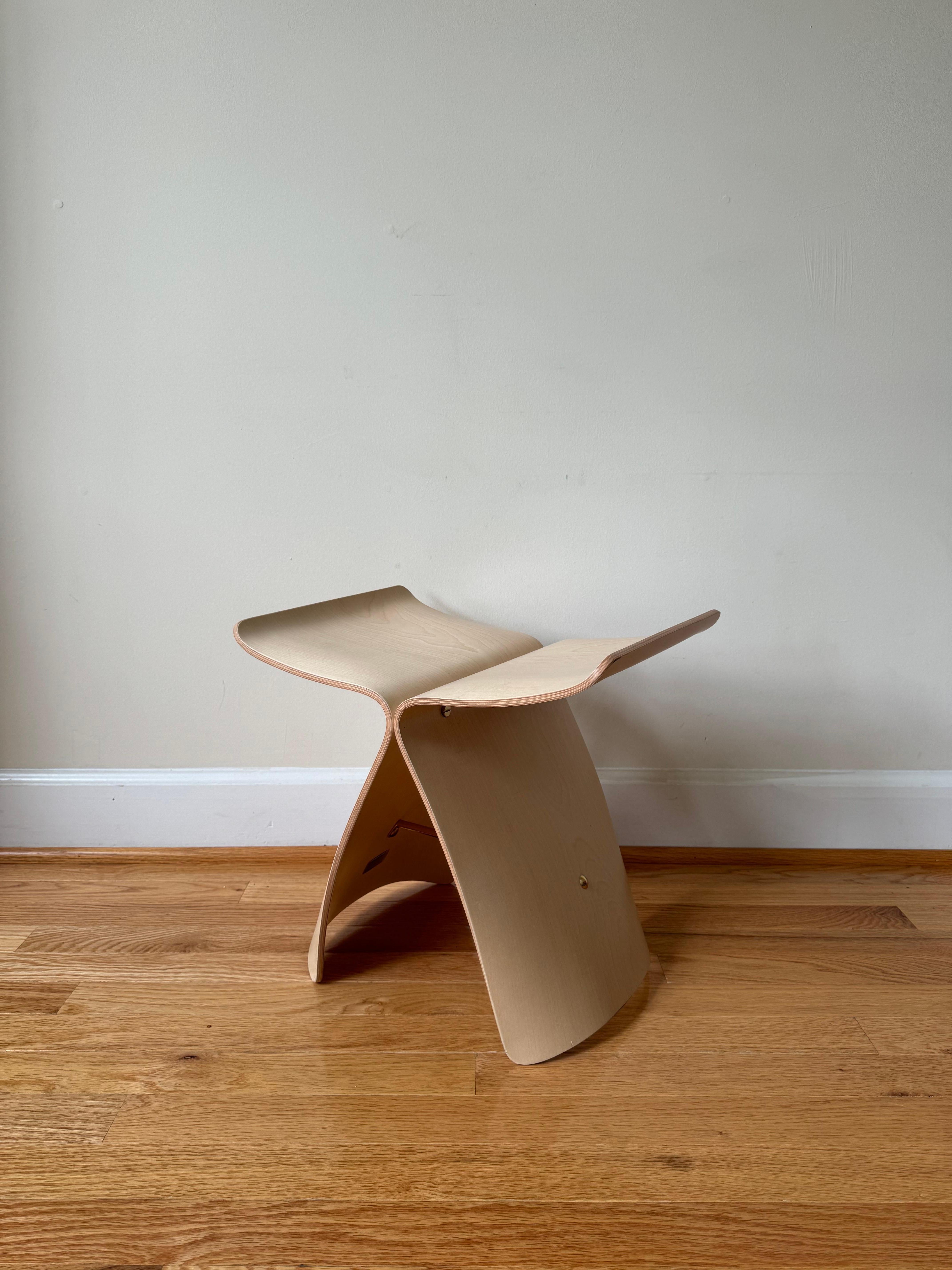 Ease of travel in the jet age encouraged a growing fusion of cultural influences after World War II. 
Although Yanagi's stool was designed and manufactured in Japan, it employs Western form (the stool) and material (bentwood). Its calligraphic