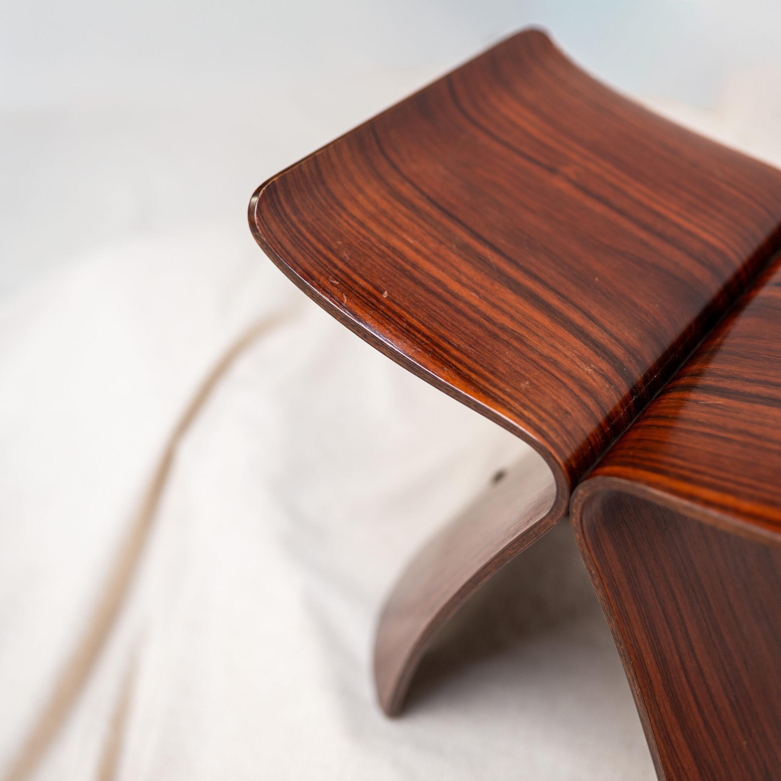 An iconic “Butterfly” stool by Sori Yanagi, combining Japanese craftsmanship with modernist elegance in a fluid sculptural form.