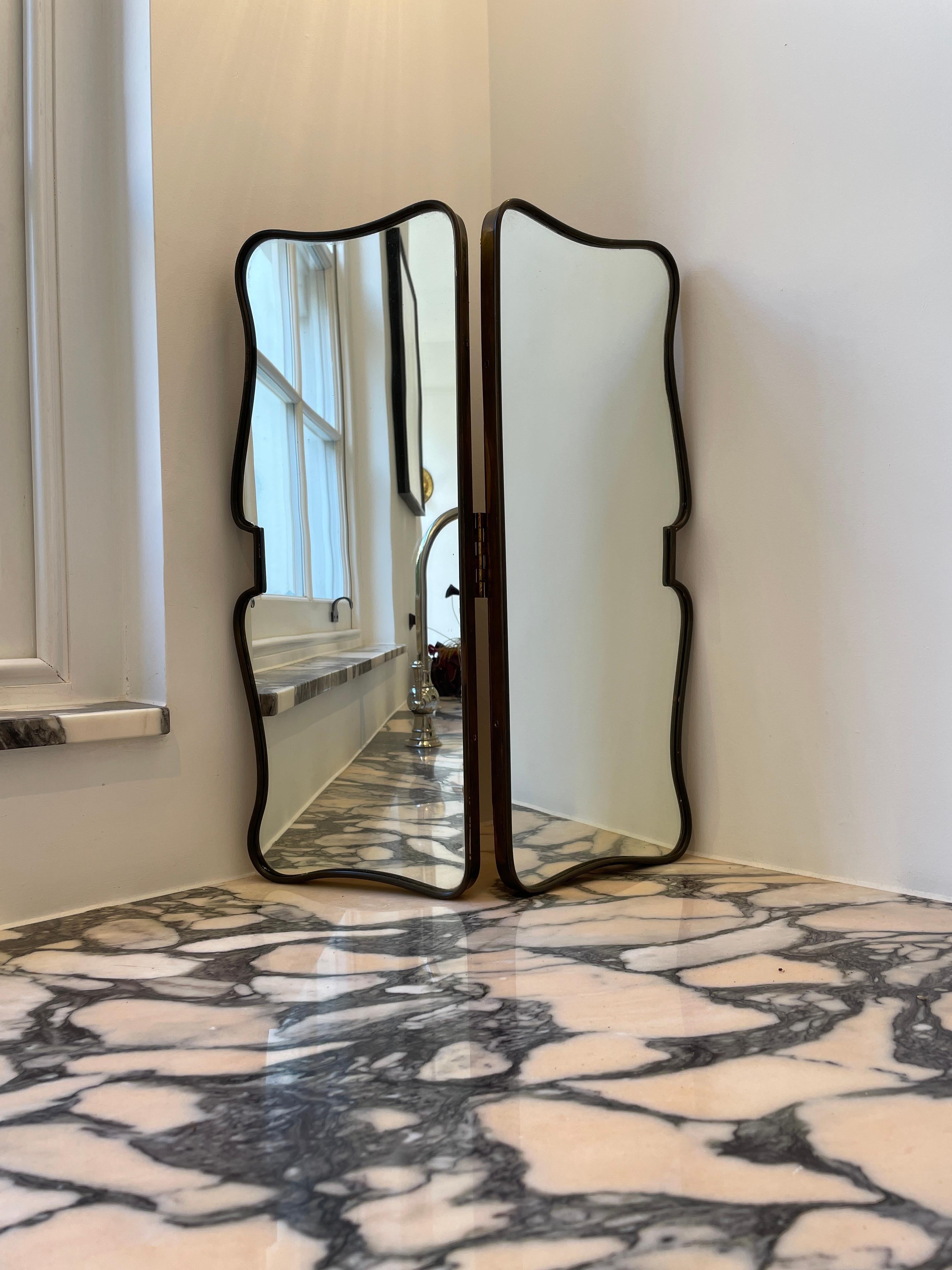 Height: 51cm
Width: 42cm 
Depth: 2cm

Designer: Gio Ponti. 
Manufacturer: Gio Ponti
Date: 1950s
Materials: Brass, glass, wood

Description: The Gio Ponti Vanity Mirror is a stunning piece of functional art designed by the legendary Italian architect