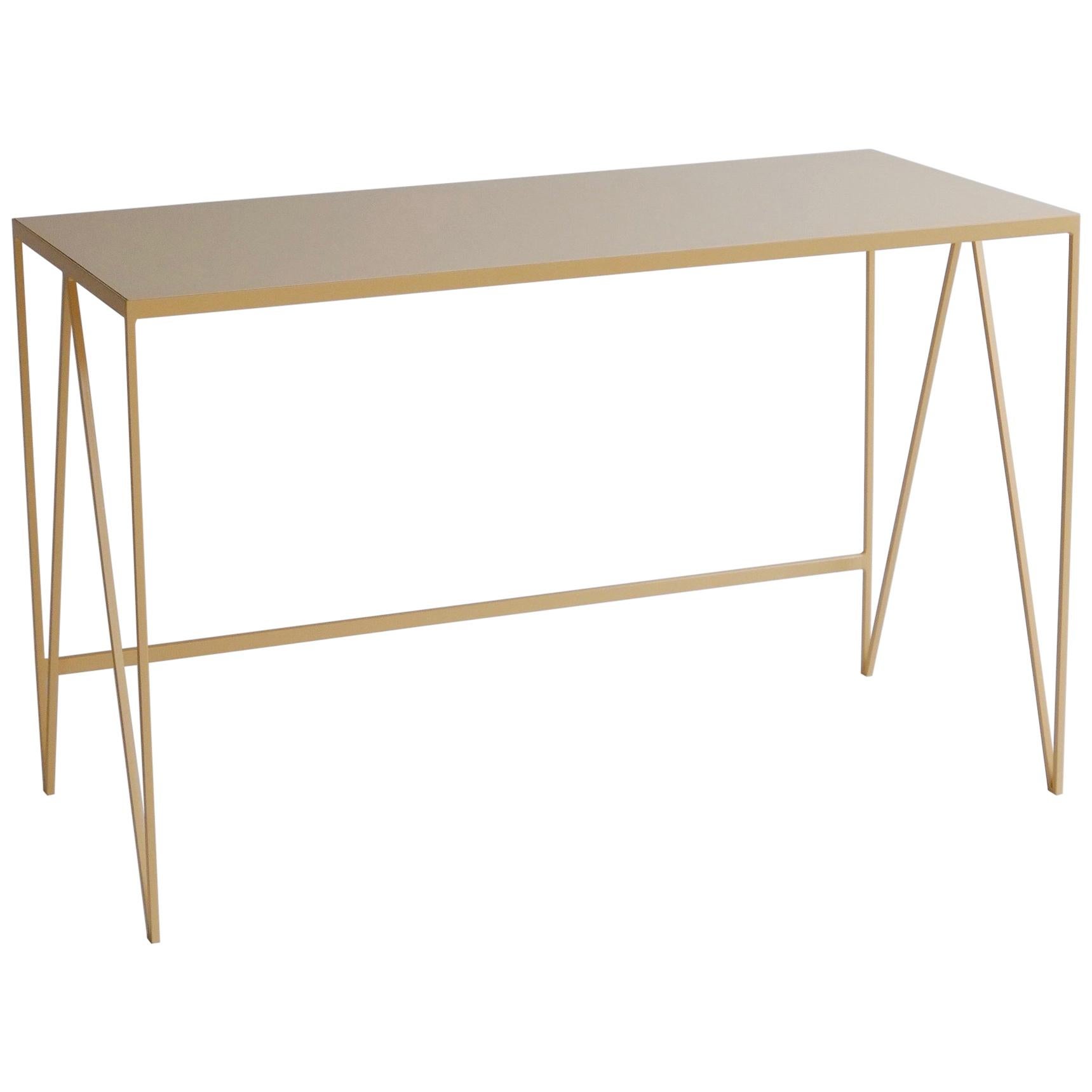 The study desk is made with a butternut powder-coated steel frame and a lacquered birch plywood tabletop. The combination of the natural wood table top and powder coated steel frame has a beautifully warm finish. This compact desk has been designed