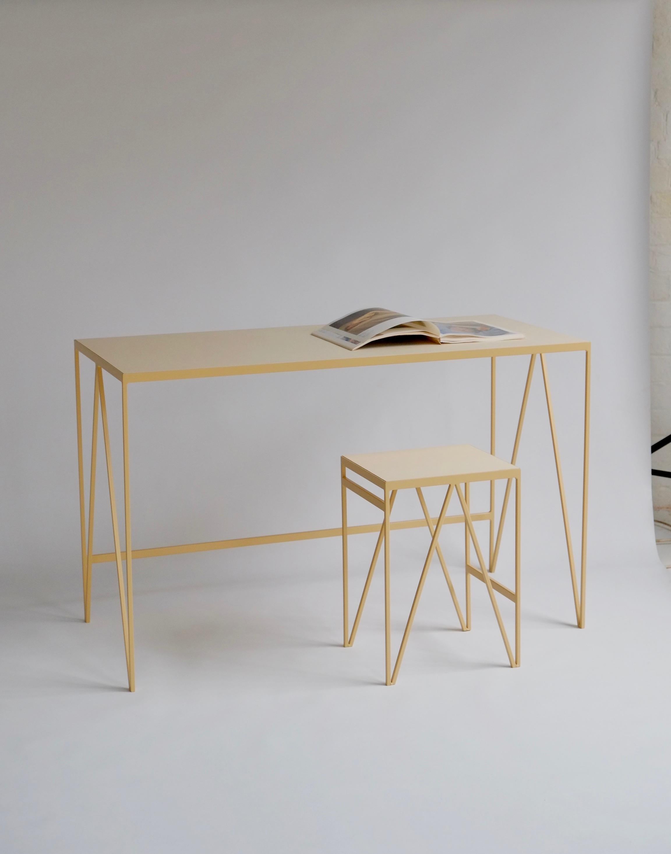 The study desk is made with a butternut powder-coated steel frame and a pearl coloured natural linoleum tabletop. The linoleum for our desks is selected for the ecological properties of the linseed of which it is made. It also has a smooth and hard