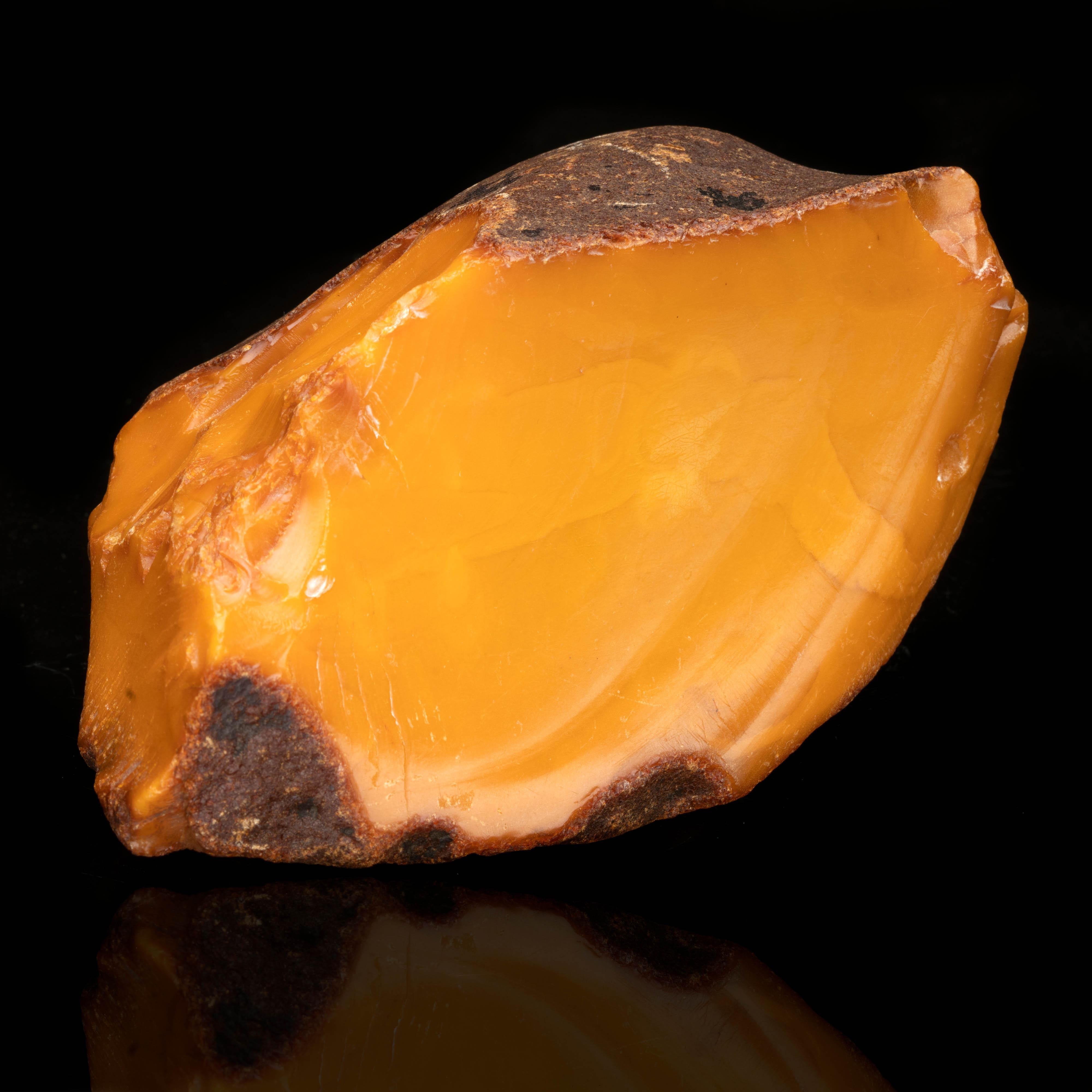 Dug in the 1980s, this sizable 385 gram specimen of genuine Baltic butterscotch amber gets its unique color or patina from 20-30 years' exposure to the elements. This weathering phenomenon is especially characteristic of Ukrainian amber. Most Baltic