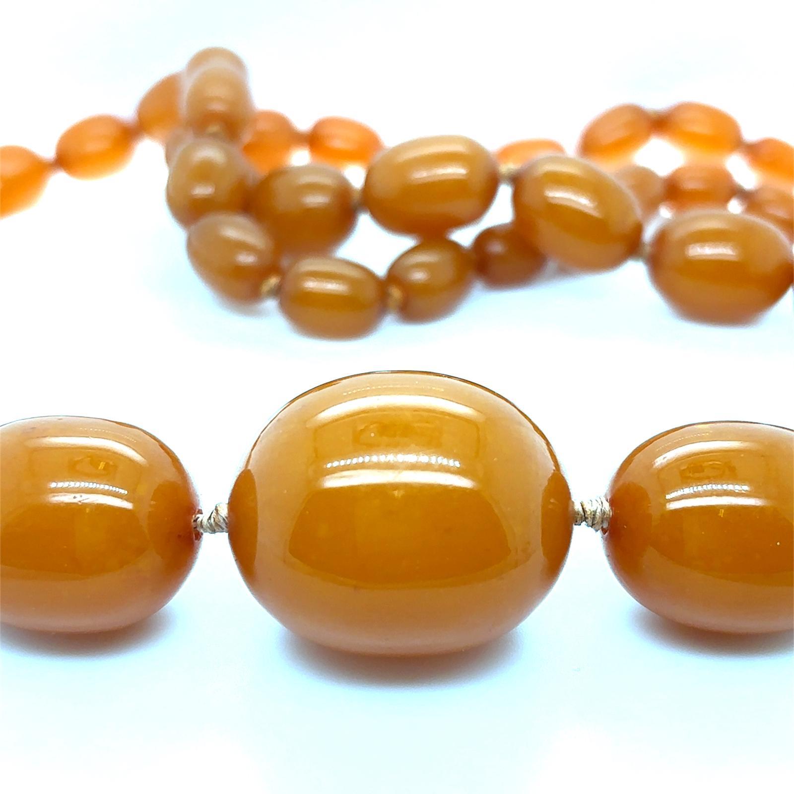 Women's or Men's Butterscotch Amber Graduated Long Bead Necklace 18 Karat Yellow Gold Clasp For Sale