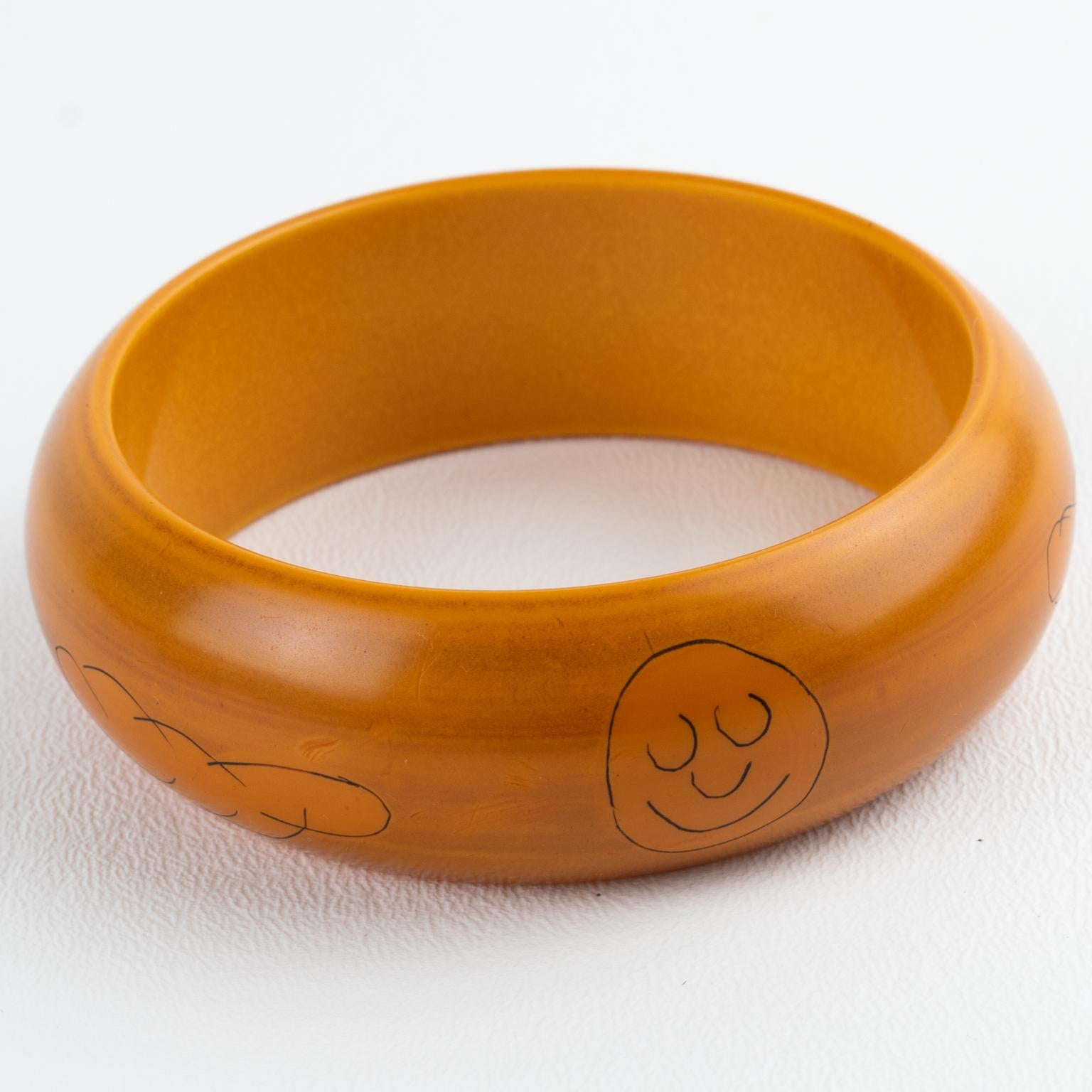 Art Deco Butterscotch Bakelite Bracelet Bangle with Pierrot Design by Butler and Wilson For Sale