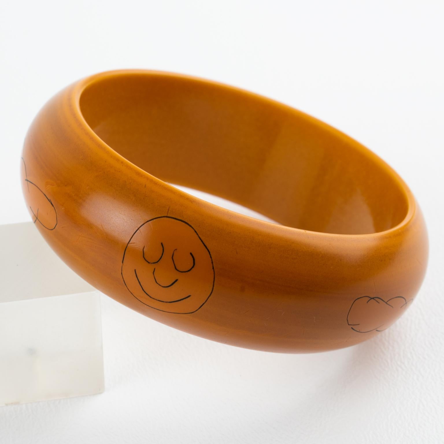 Women's or Men's Butterscotch Bakelite Bracelet Bangle with Pierrot Design by Butler and Wilson For Sale