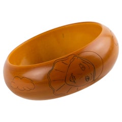 Butterscotch Bakelite Bracelet Bangle with Pierrot Design by Butler and Wilson