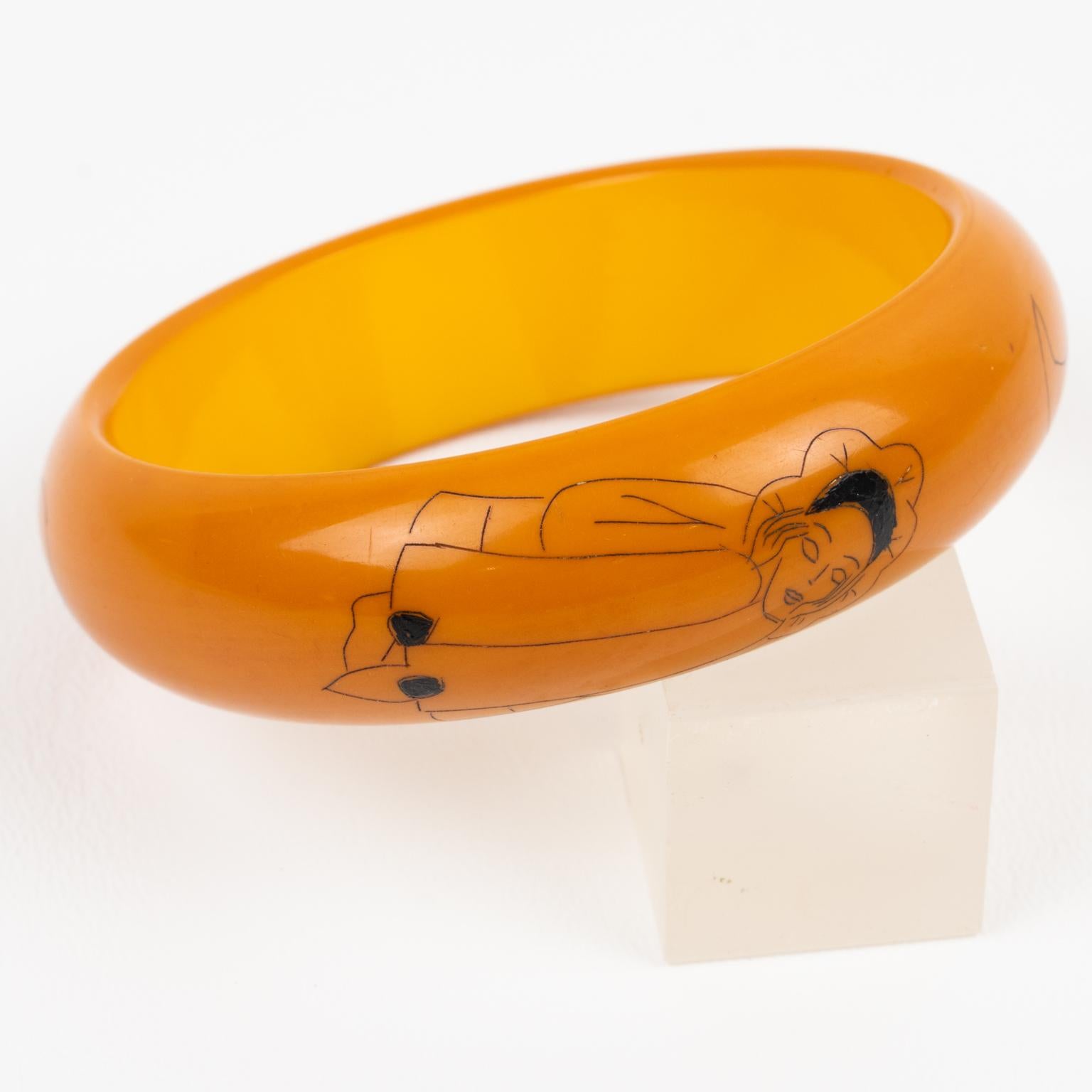 Lovely and rare Bakelite bracelet bangle with pierrot - clown design. Chunky domed shape with warm butterscotch color and black contrasting designs. The bracelet is ornate with 2 pierrot designs, one standing and one sitting and in between those two