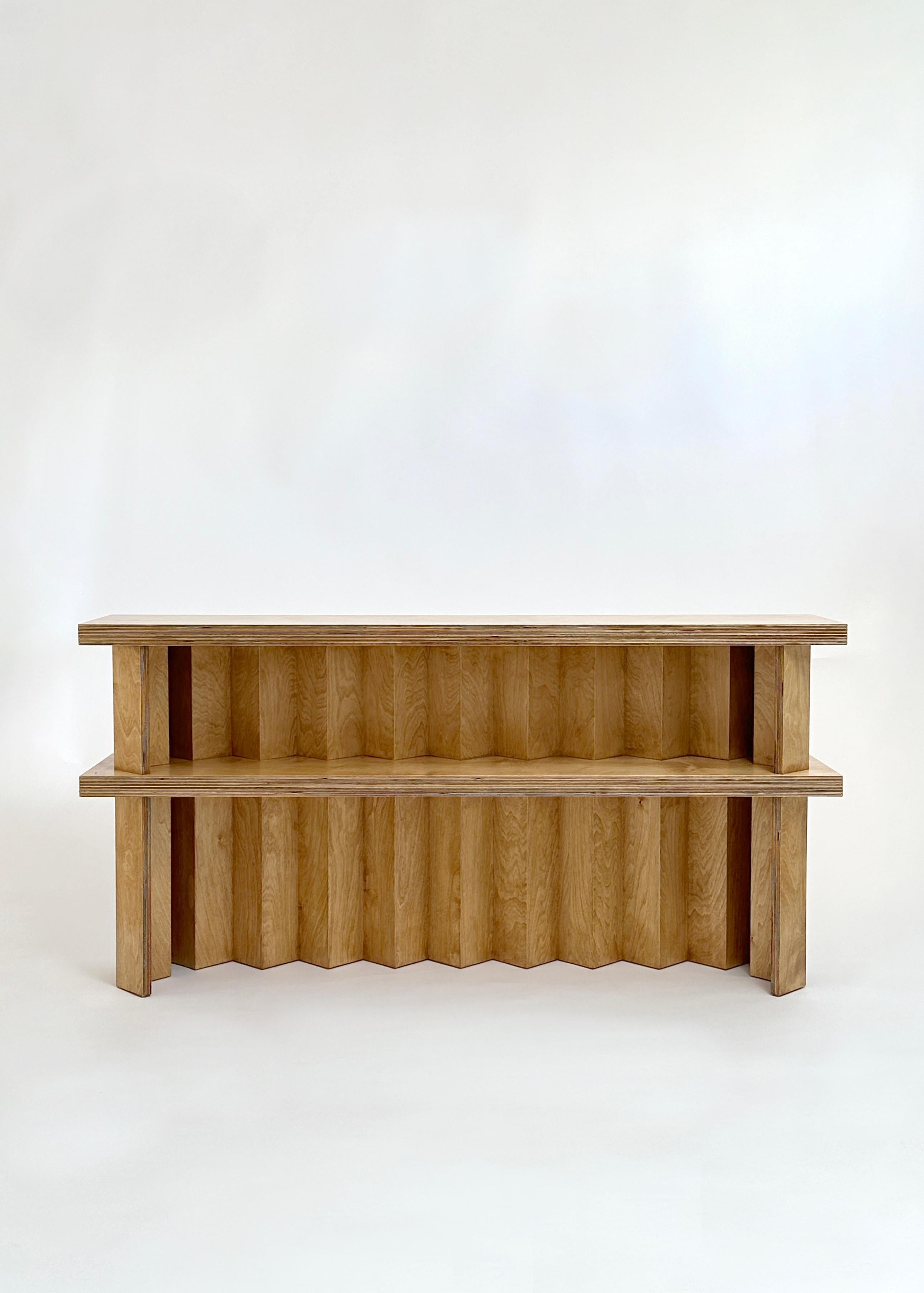 Foundation console by Goons 
Dimensions: W 174 x D 35 x H 120 cm
Materials: Birch plywood.
Butterscotch finish.
Dimensions can be adjusted +/- 10 cm

Goons is located in Paris, France. All of their designs are made out of wood.