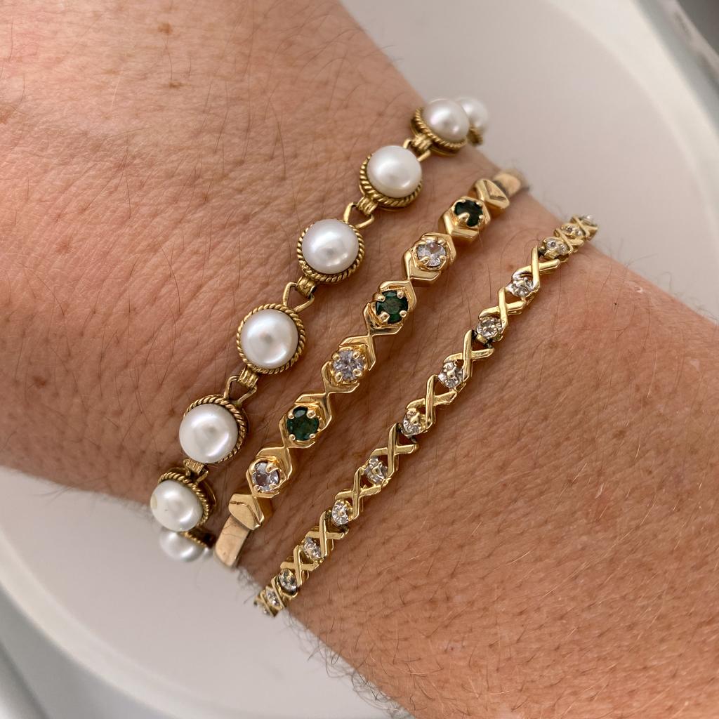 These button pearls are beautifully matched in this graceful bracelet, a little unusual and always elegant. Each pearl gracefully nestles atop a link with rope detail wrapping the edge for a perfect contrast. This would make a beautiful pearl piece