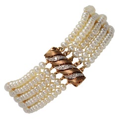 Button Pearl Multi Strand Bracelet with Gold Diamond Swirl Charm Clasp