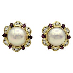 Button Pearl Stud Earrings with a Ruby and Diamond Halo in 18 Karat Yellow Gold