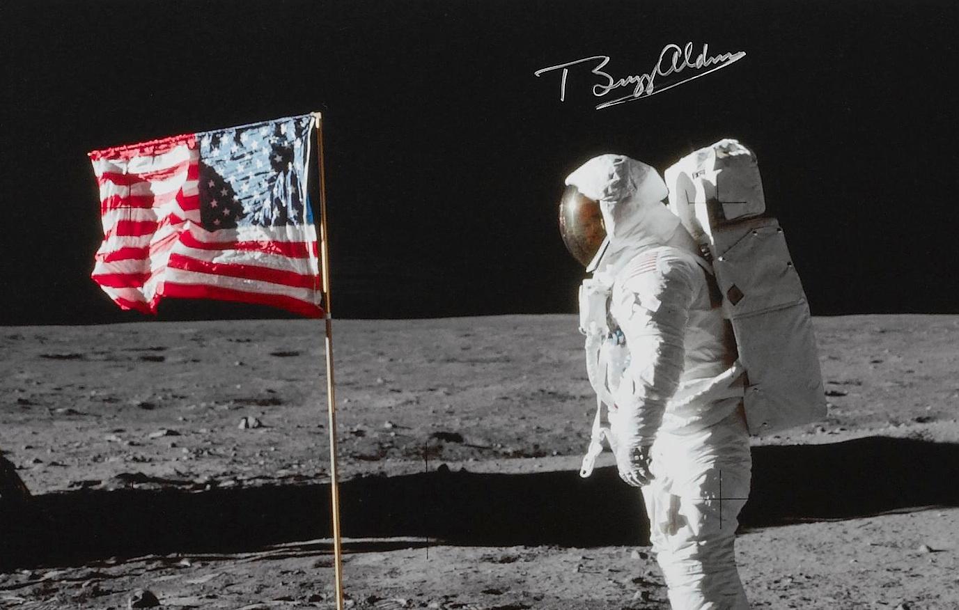 Presented is an exclusive Apollo 11 Collage, including authentic materials relating to astronauts Neil Armstrong and Edwin “Buzz” Aldrin. The collage is made up of the following elements: Astronaut Buzz Aldrin with Flag Autographed Photograph; Neil
