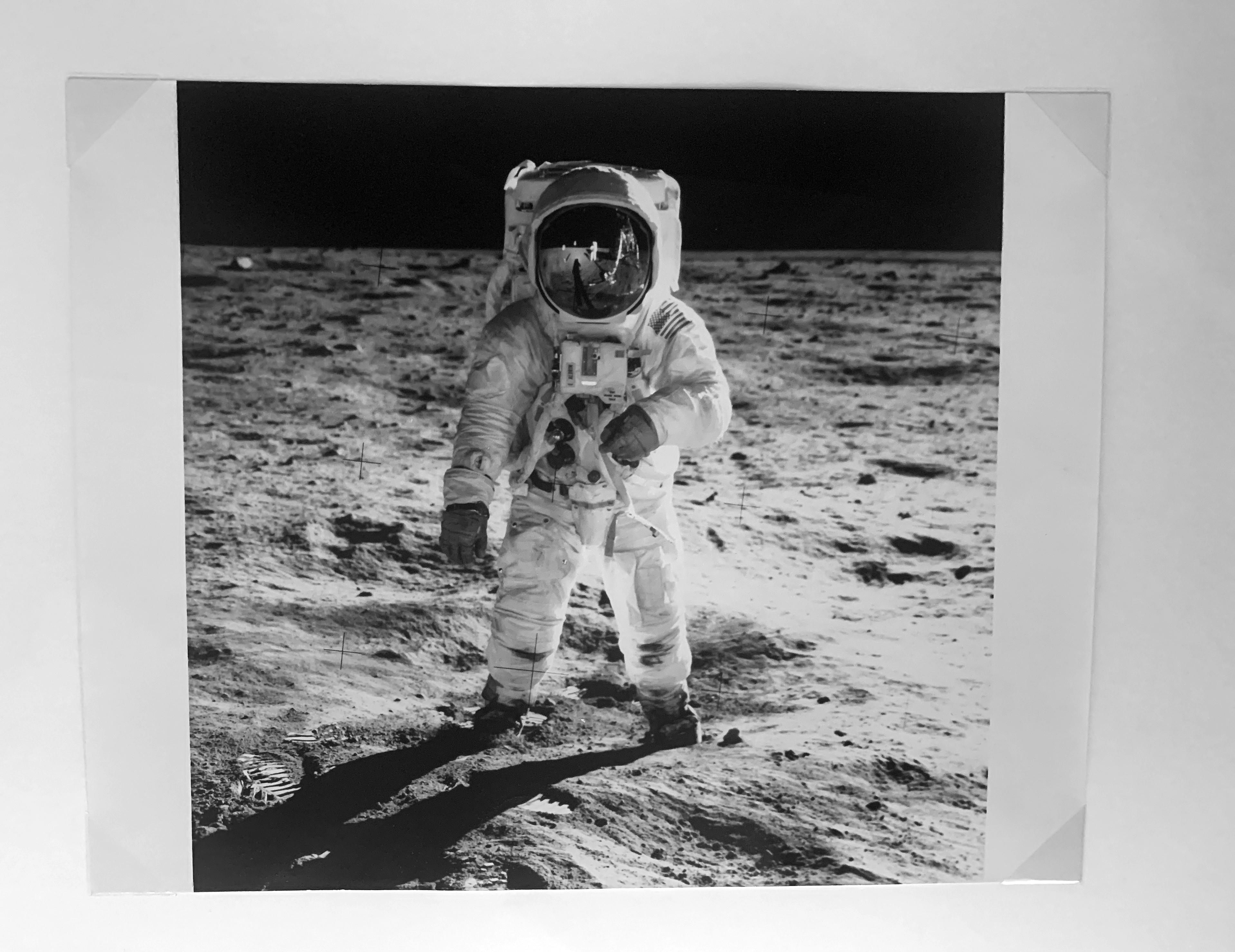 An 11 x 14 black and white print of Buzz Aldrin from the original negative before Nasa added “more” space on the top of the image, which is common and the version of Visor that most people have. The 11 x 14 gelatin silver NASA prints were made as