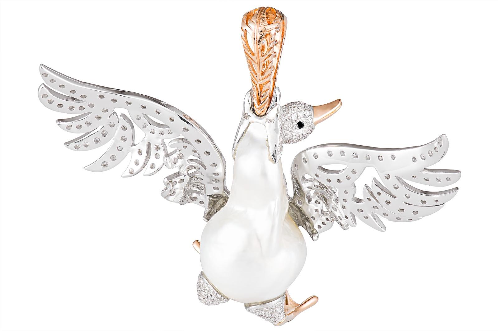 This one of a kind swan pendant is an exceptional example of Buzzanca unique animal collection pieces.  The Australian baroque pearl is effortlessly transformed into the swan's body and tail.  Carefully selected diamonds glitter in her open wings as
