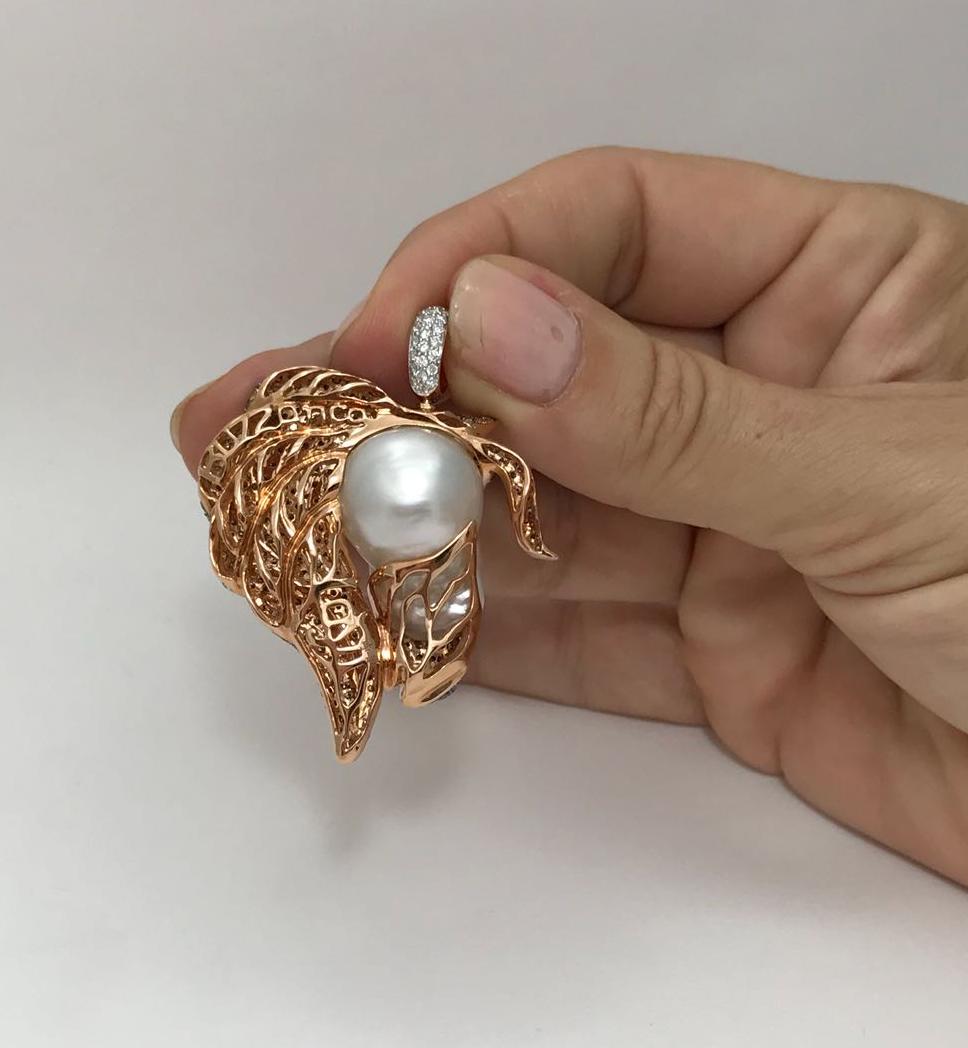 This is a unique one of a kind Buzzanca animal collection piece. The Australian baroque pearl measuring 17.5 mm in diameter, has natural muscle markings, that effortlessly resembles the head of the horse.  His mane is crafted with carefully selected